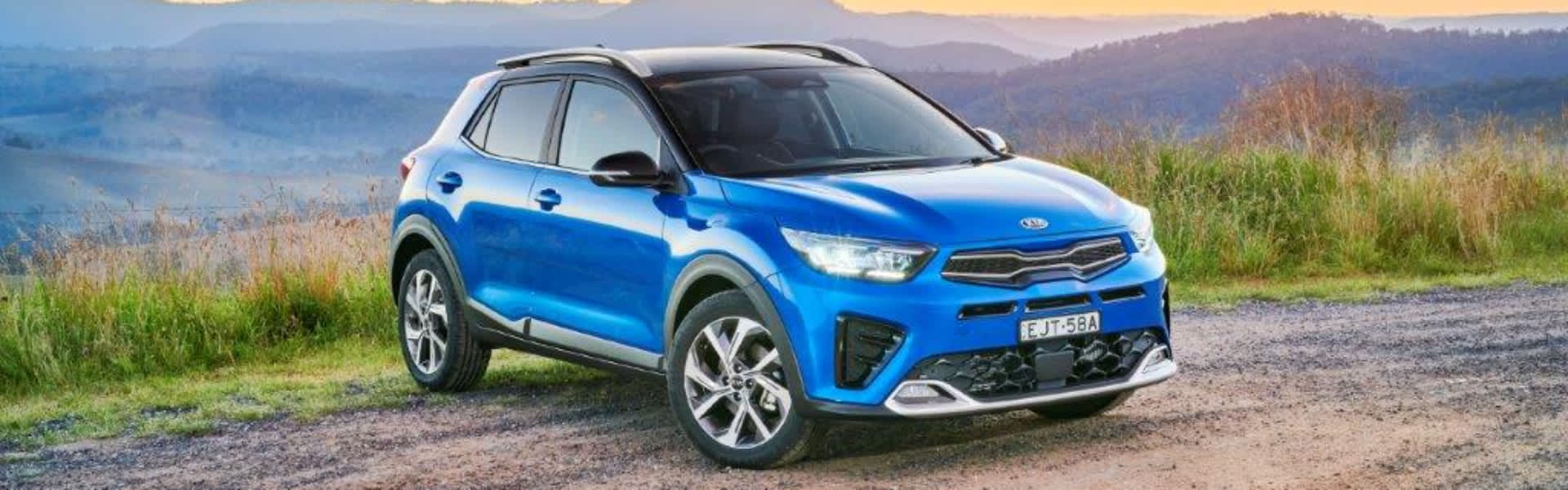 Blue Kia Stonic parked on mountain top