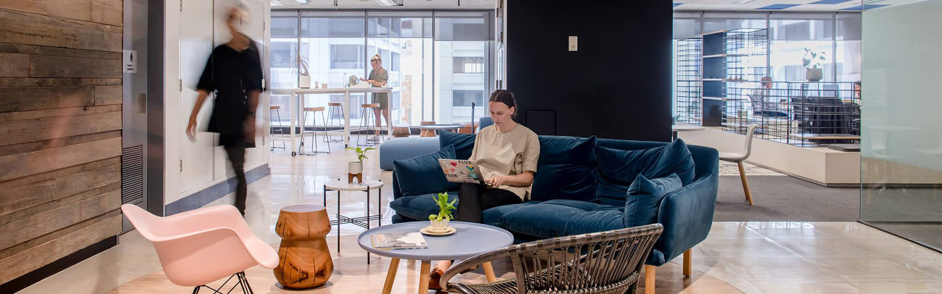 Image of people working and moving through an office