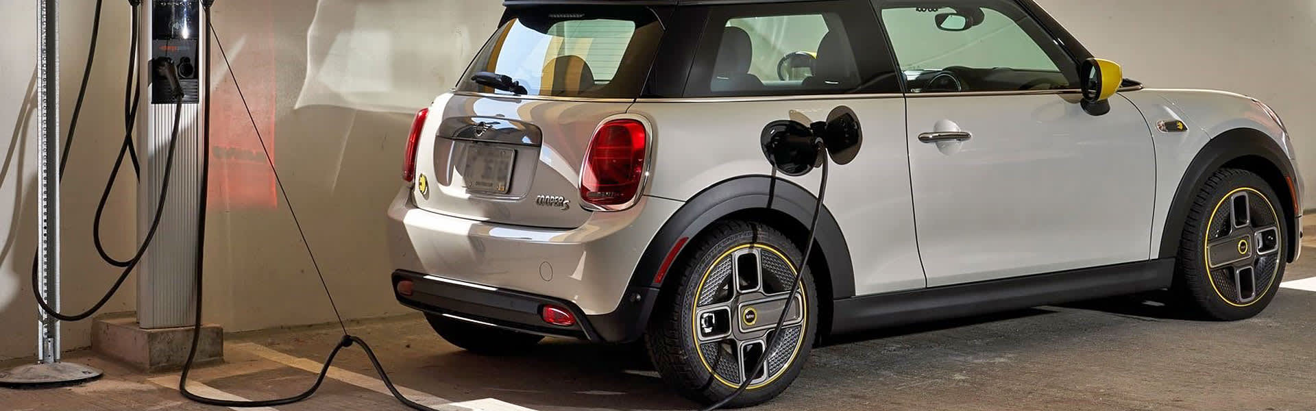 Mini Cooper EV hooked up to a charger