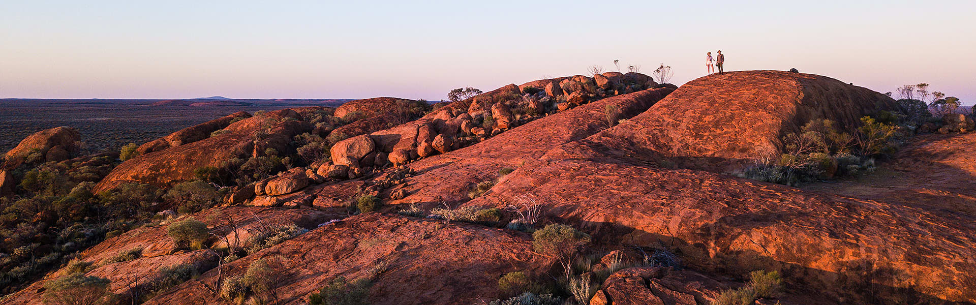 Image of people on top of a rock