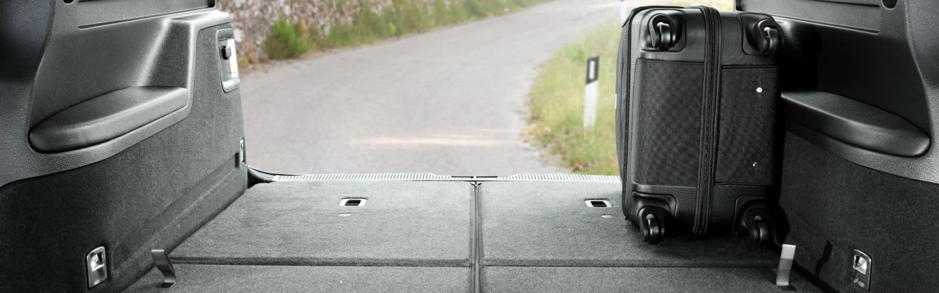 A suitcase in a car boot