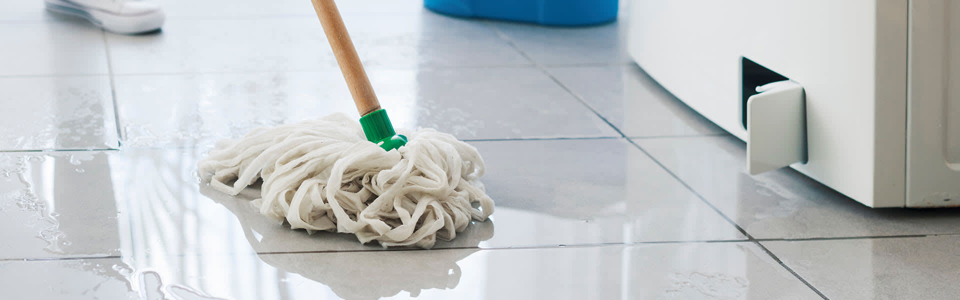 Mopping up wet tiles