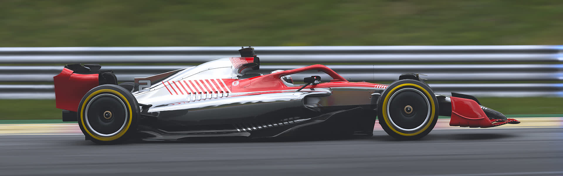 A Formula 1 car racing on a track with the background blurred to show speed