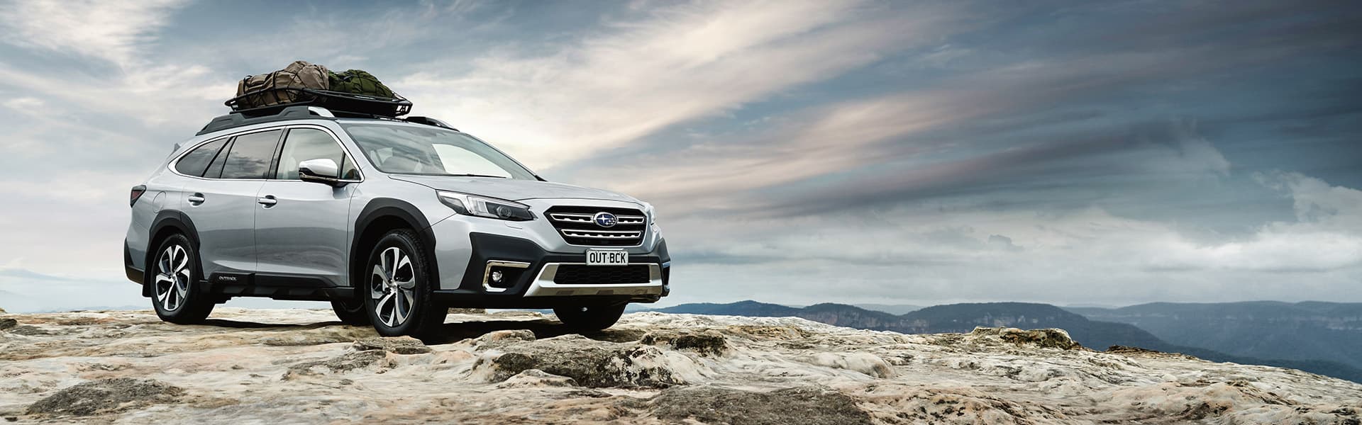 A Subaru Outback on rocky terrain