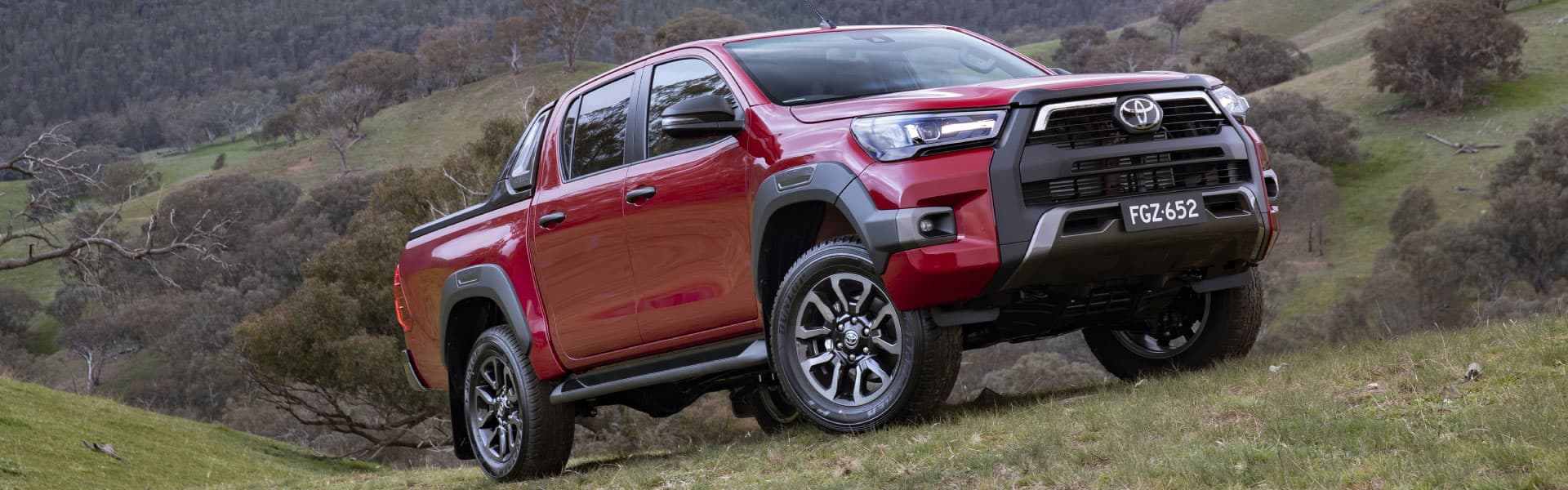 Red Toyota HiLux Rogue driving off road