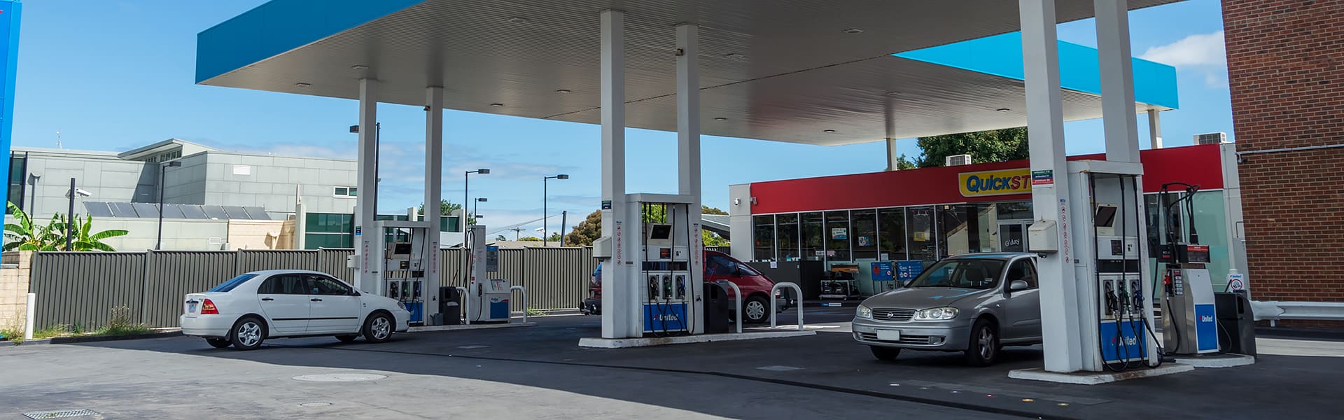 Motorists refuelling their cars at a fuel station