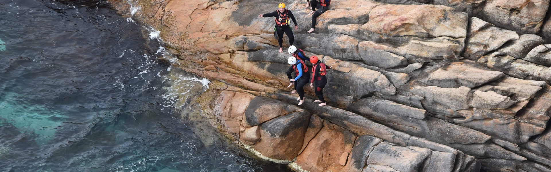People standing on coastline