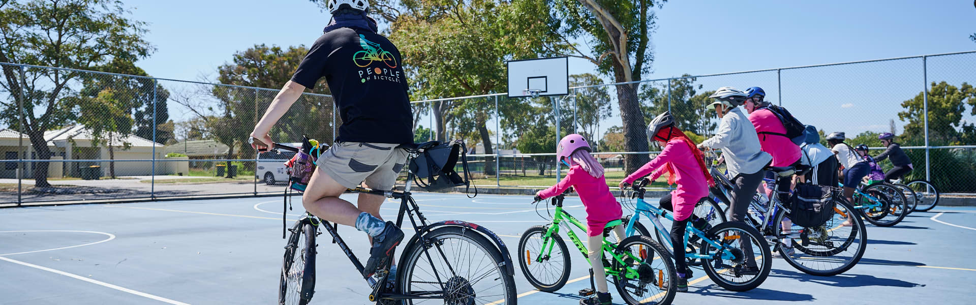 People lined up ready to ride their bikes