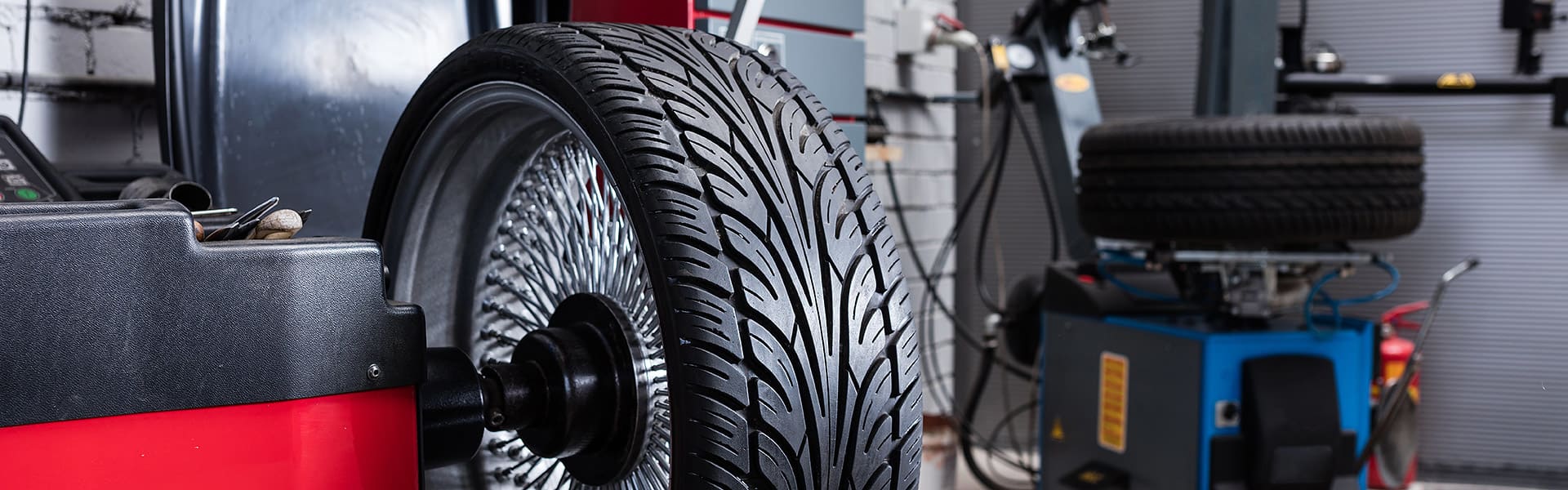 Wheel being rotated in a car workshop