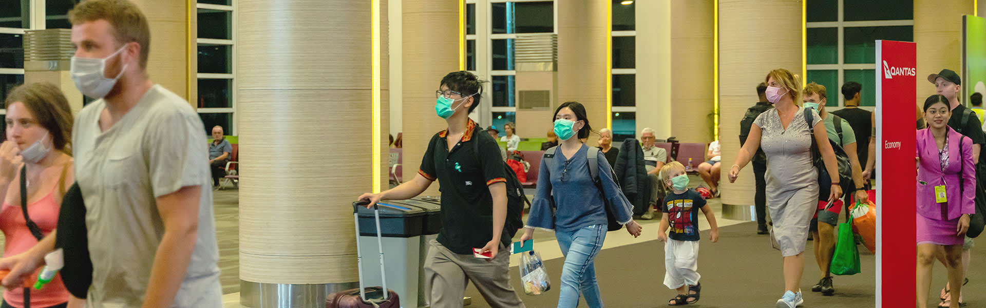 Travellers wearing a mask in airport