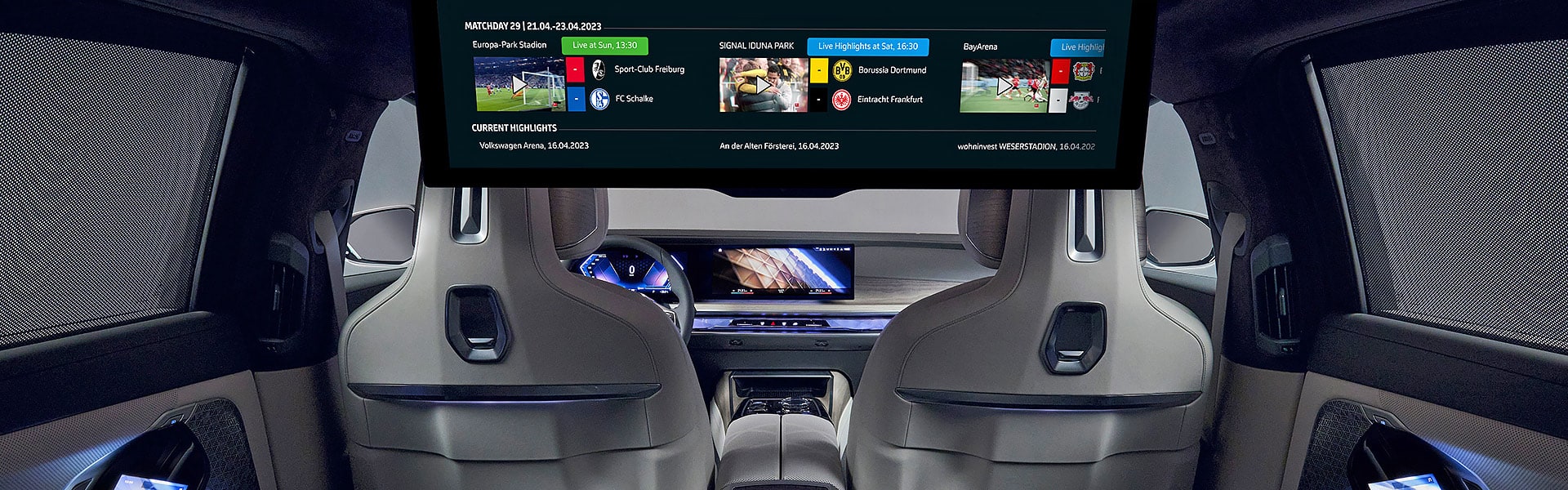 Interior of BMW 7 series vehicle showing the theatre screen