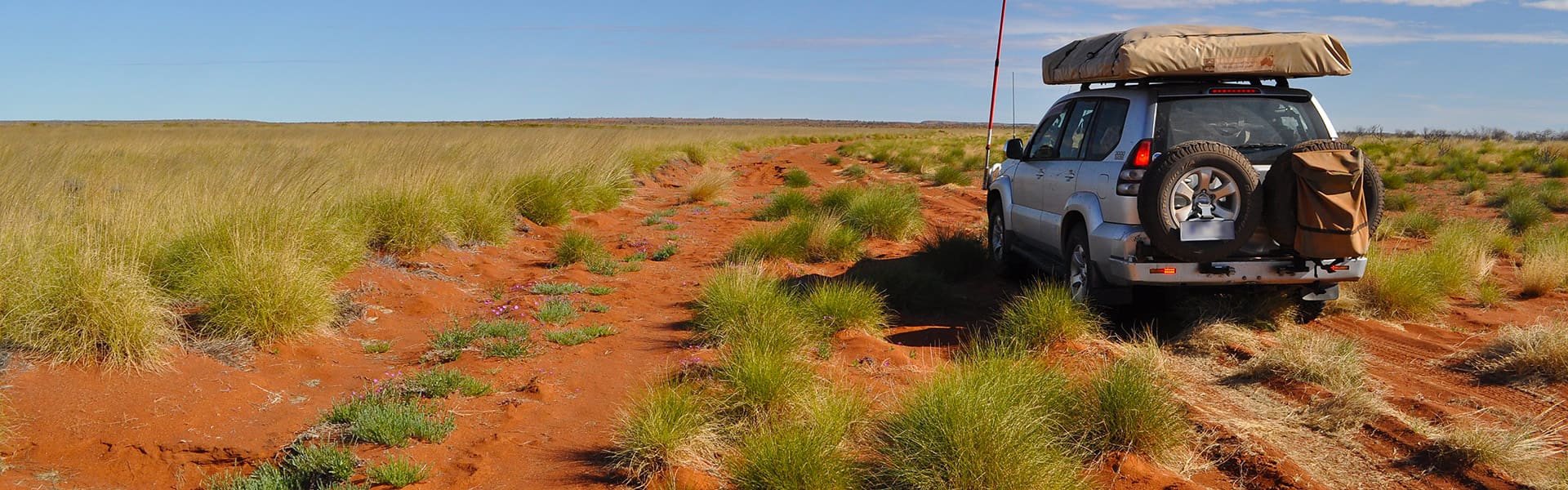 Four-wheel drive on red sand