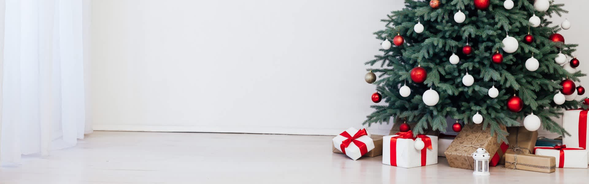 Presents under Christmas tree inside home