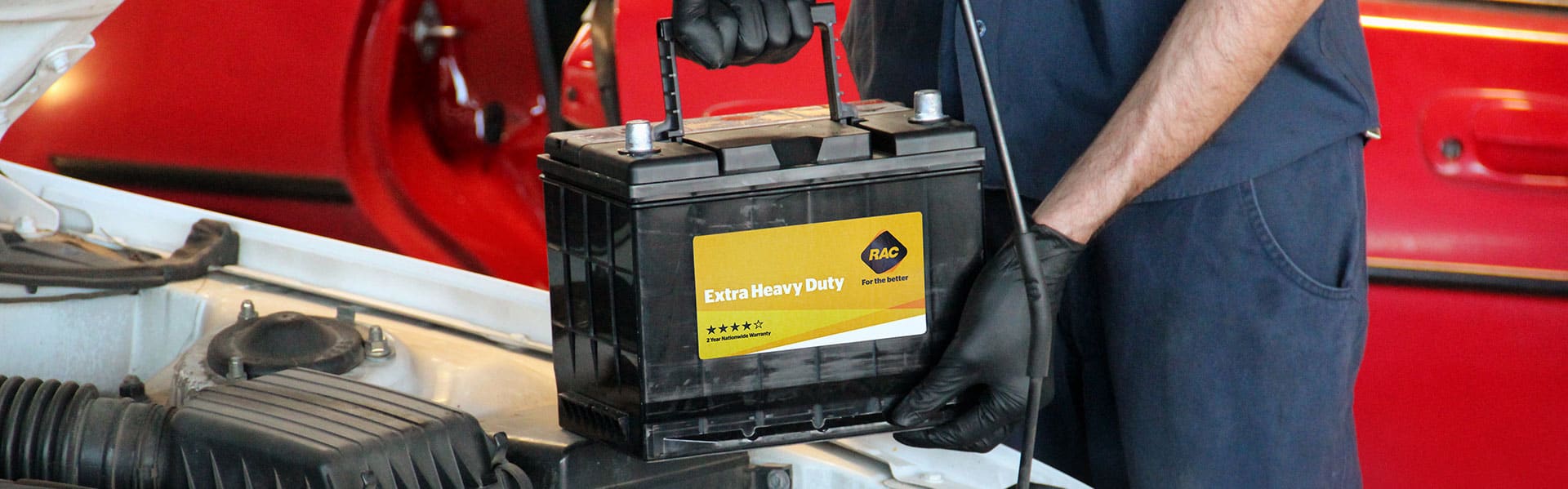 Mechanic installing a car battery