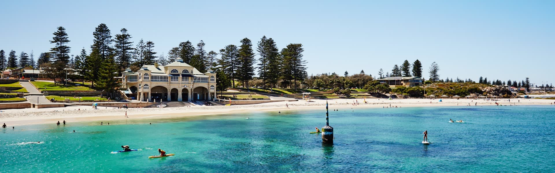 Photo of turquoise water at Cottesloe Beach with Indiana Teahouse in the background