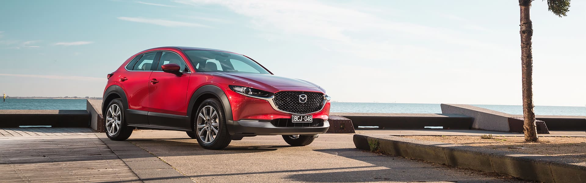 A red Mazda CX-30 X20 hybrid car