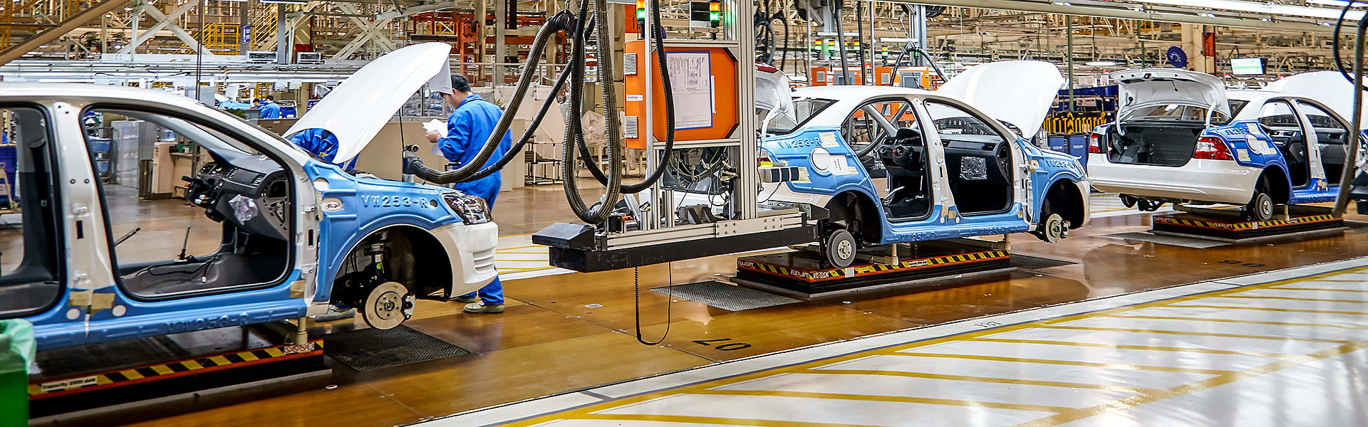 Workers on a production line in a car factory in Shanghai