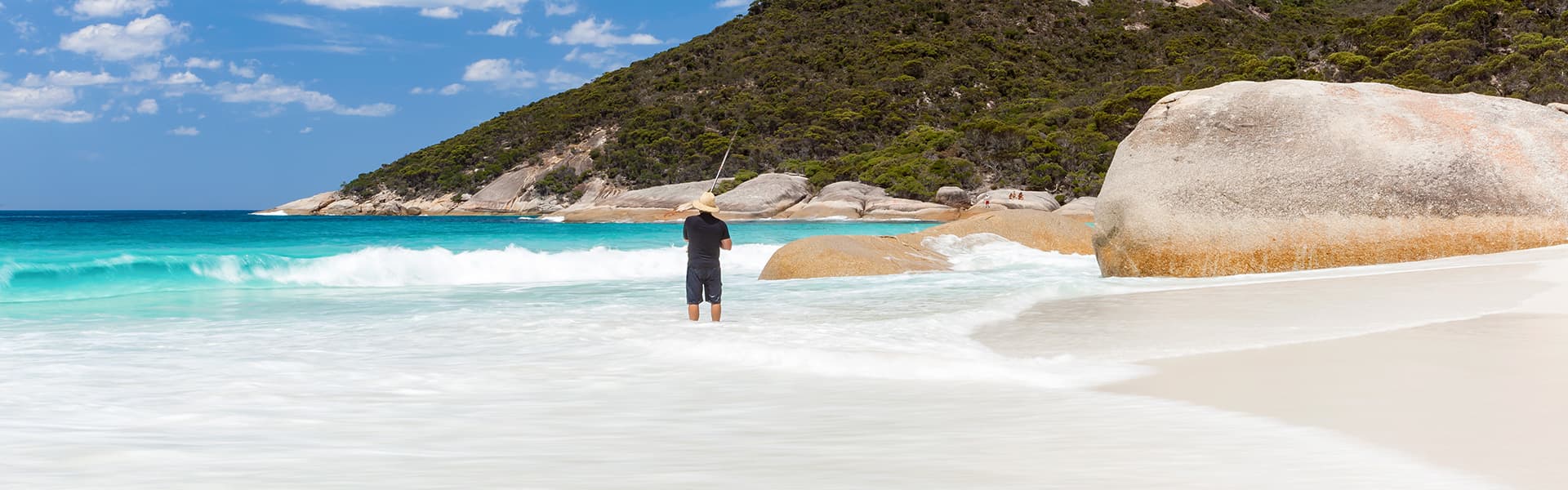 Man fishing on a beach