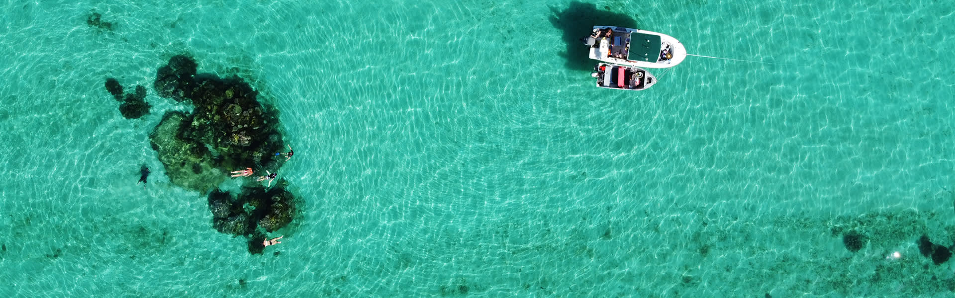 Image of a boat with snorkellers