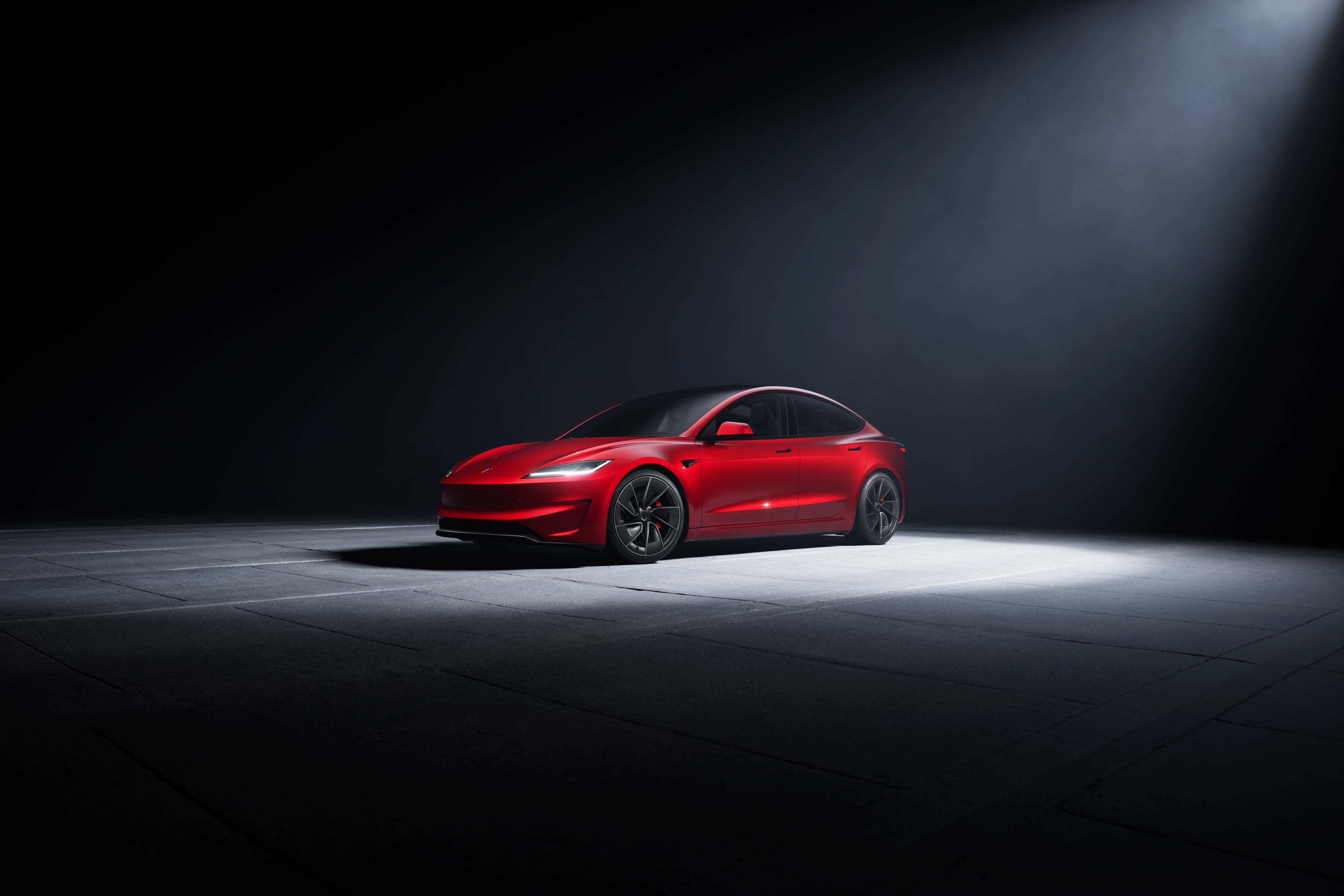 A red Tesla Model 3