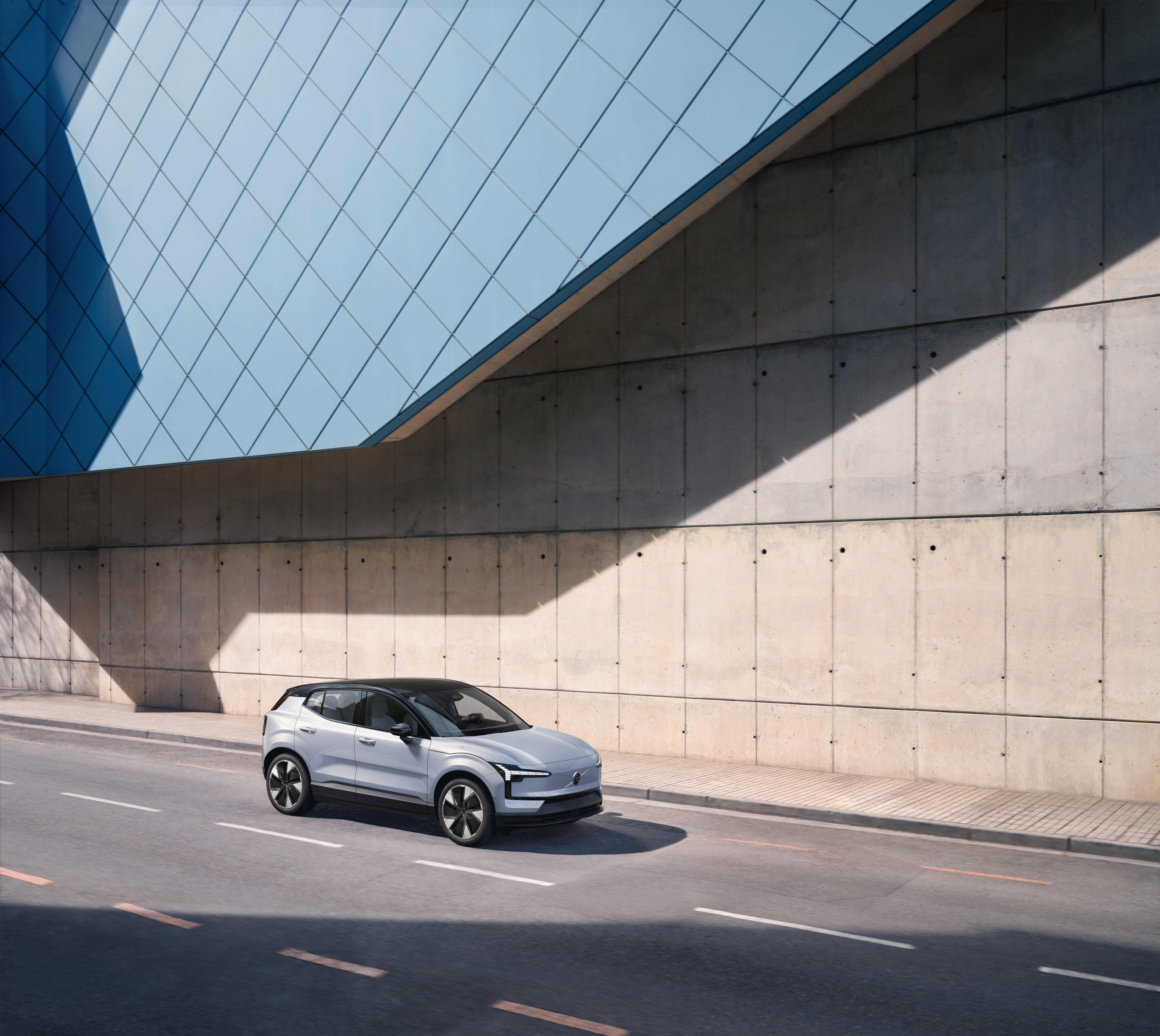 A silver Volvo EX30 parked outside