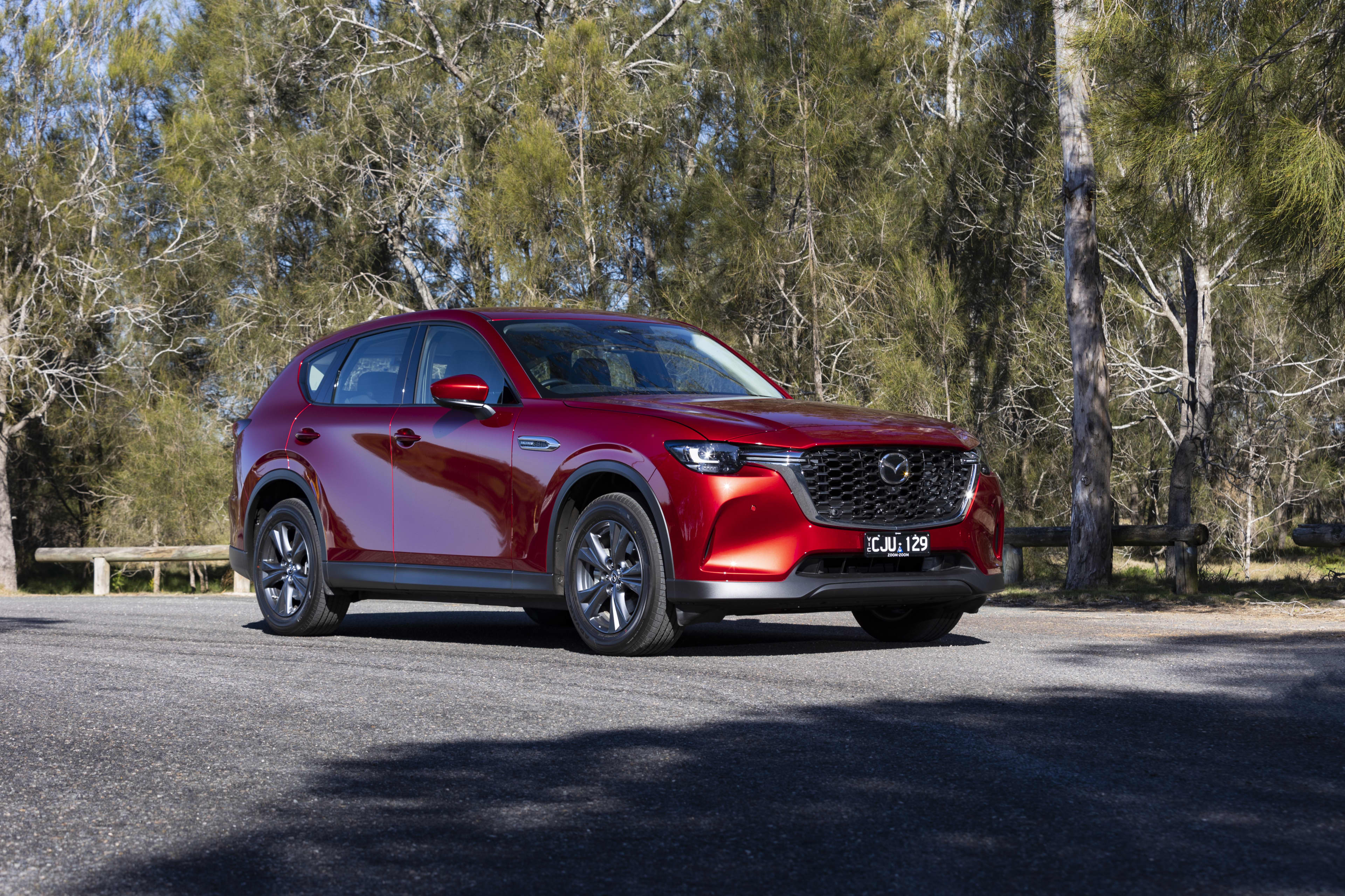 A red 2025 Mazda CX-60 Evolve