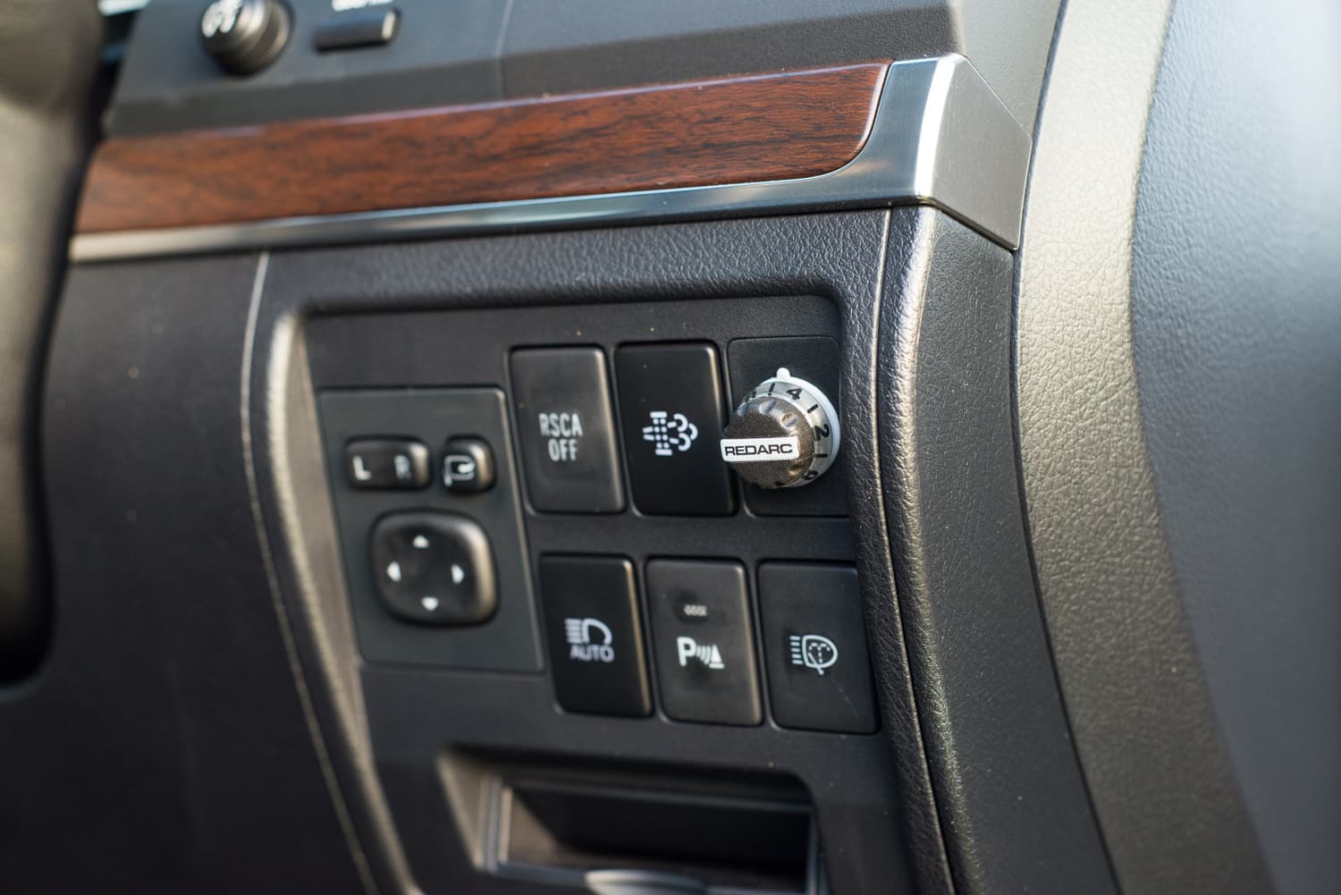 A modern brake controller fitted to a car dashboard