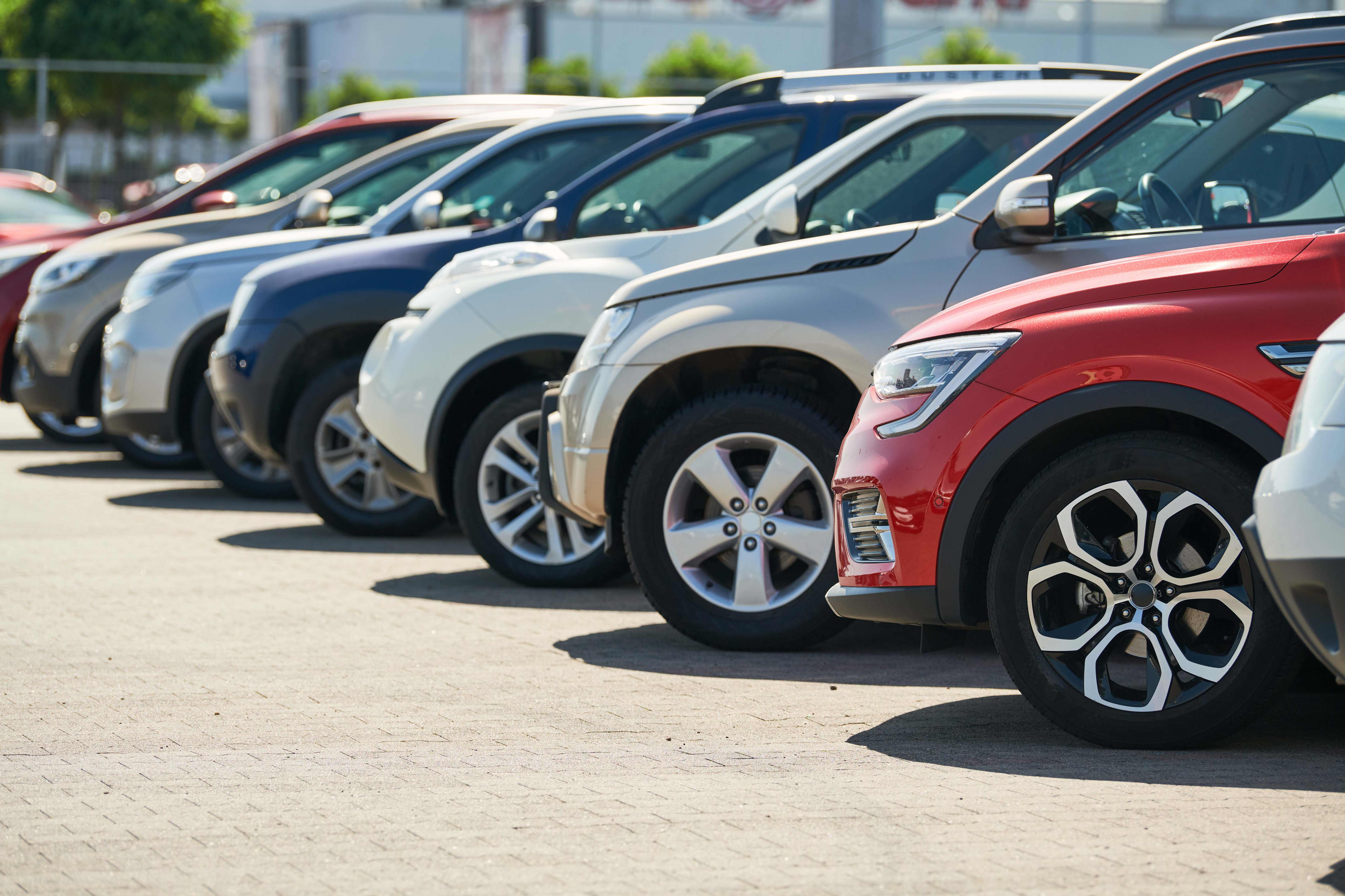 A row of cars seen from a side view at ground level