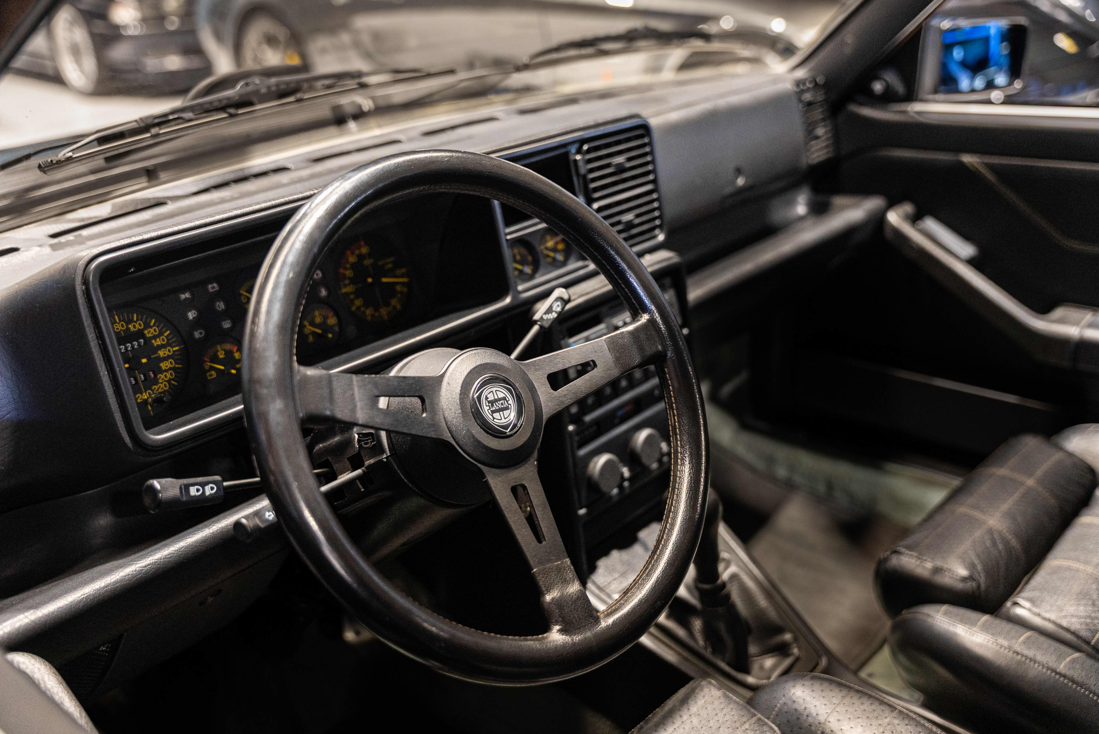 Interior shot of dashboard and steering wheel of a Lancia Delta Integrale