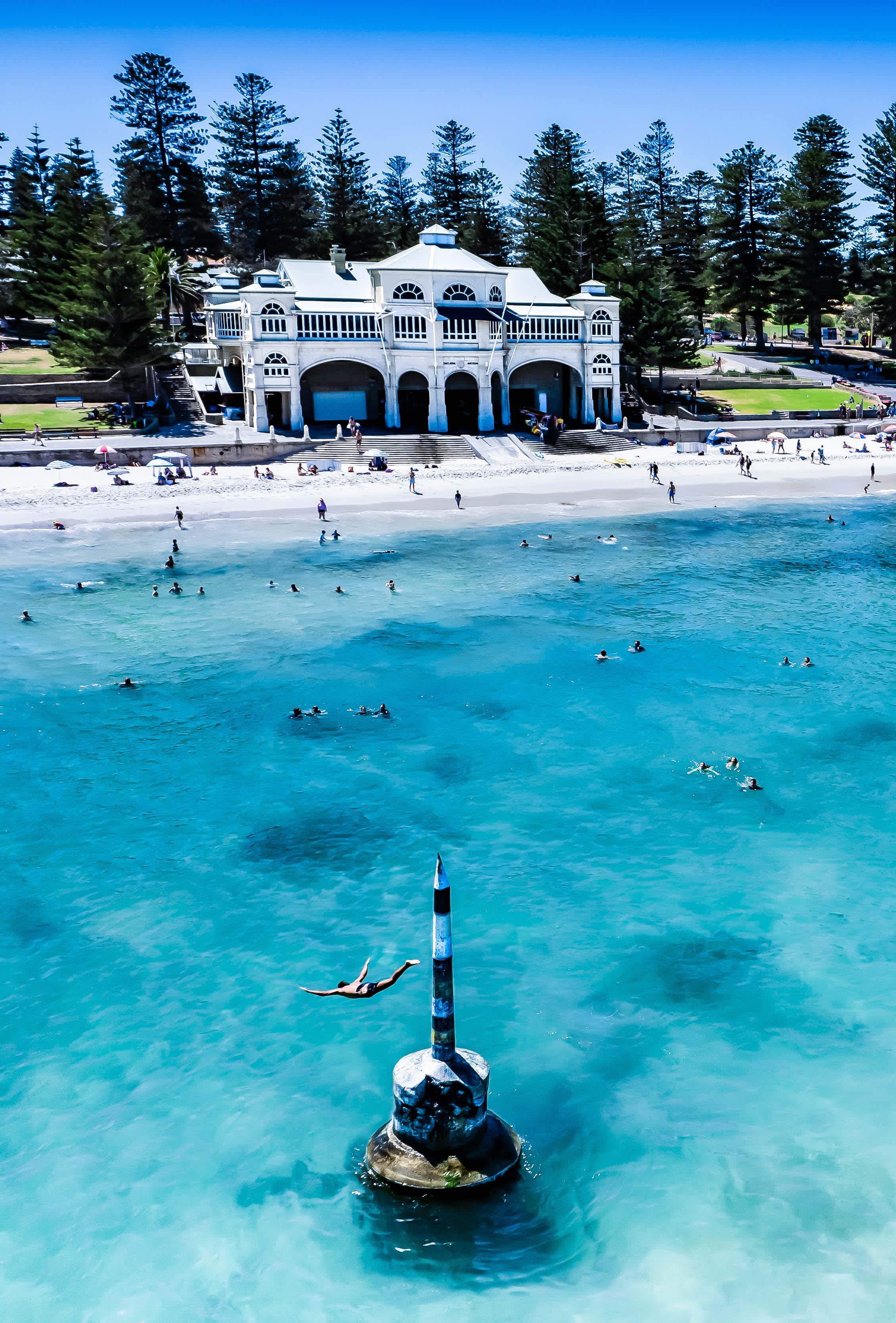Someone diving from the concrete pylon off Cottesloe Beach.