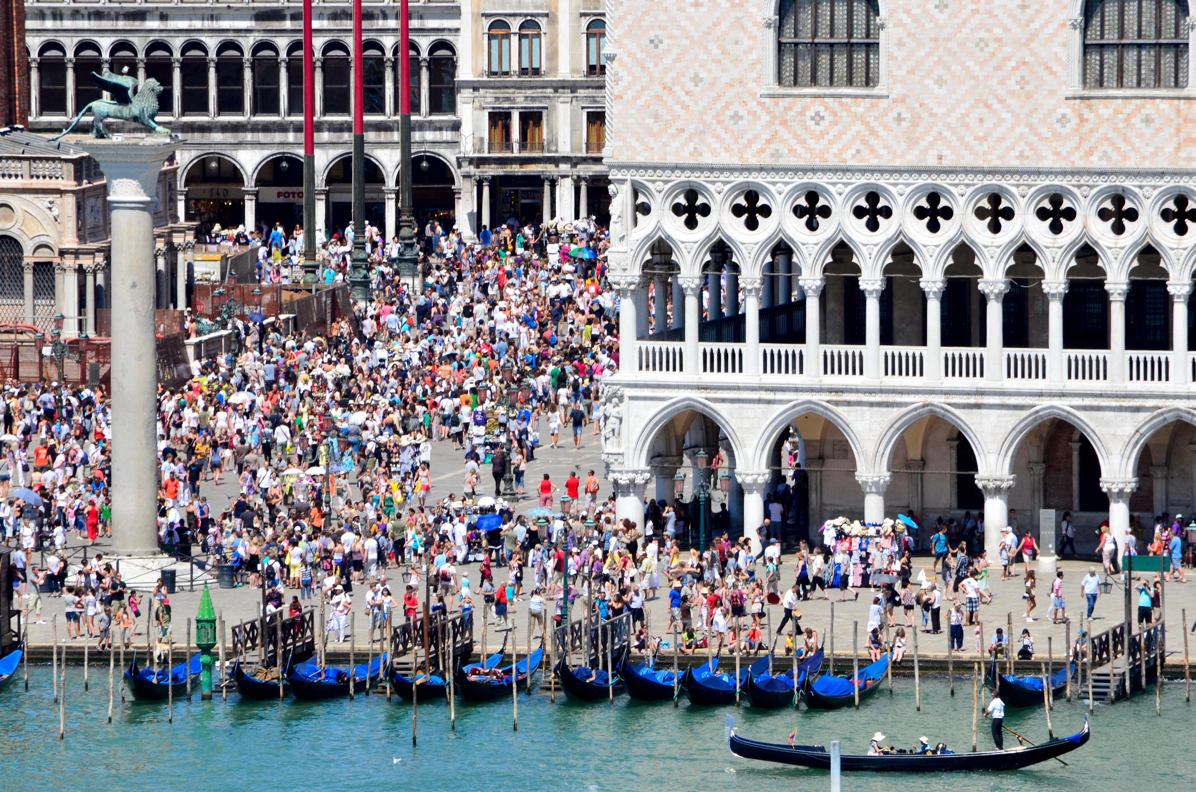 Summer tourists crown St Mark's Plaza in Venice, Italy