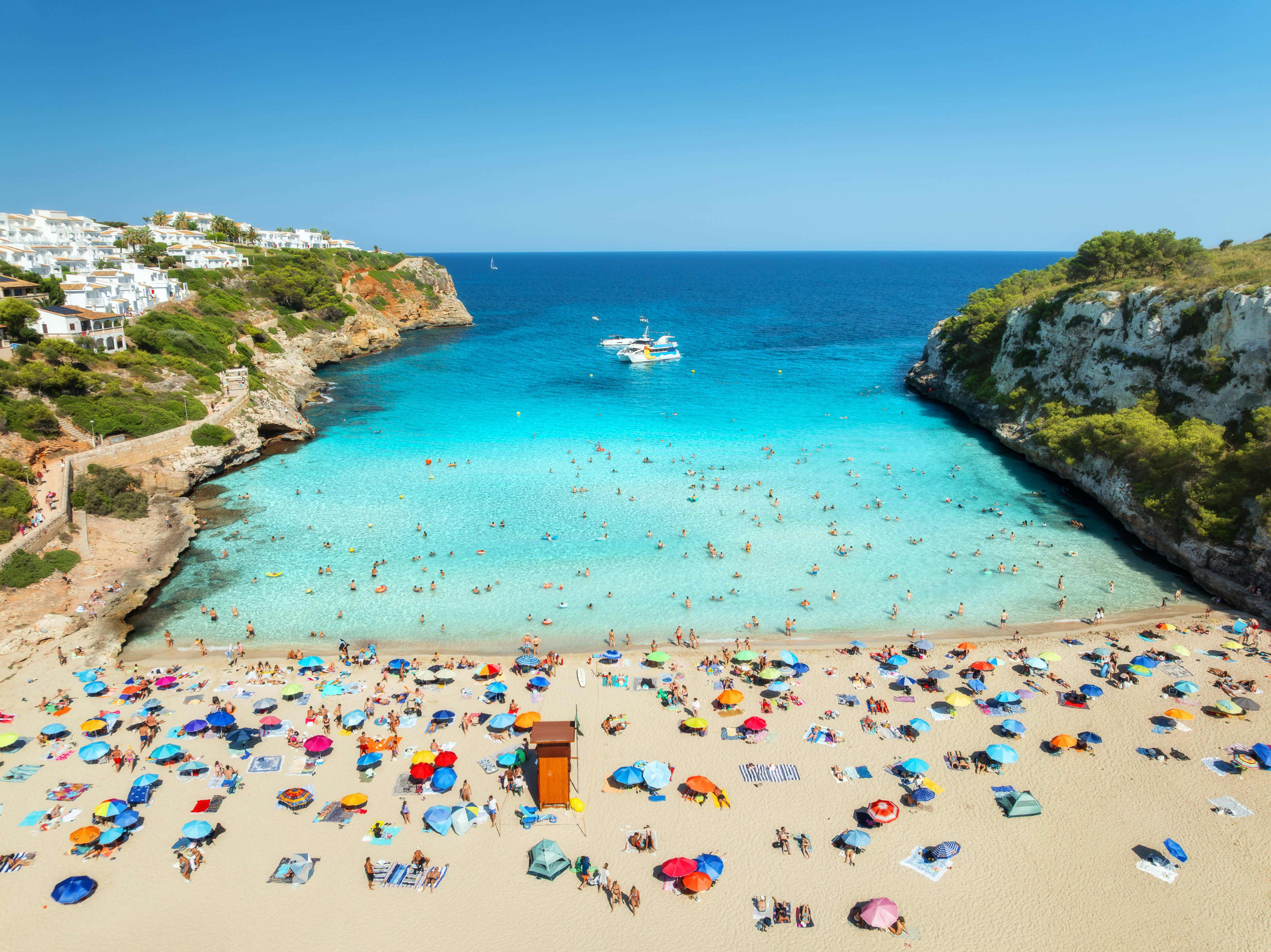 Tourists on a crowded beach in Spain