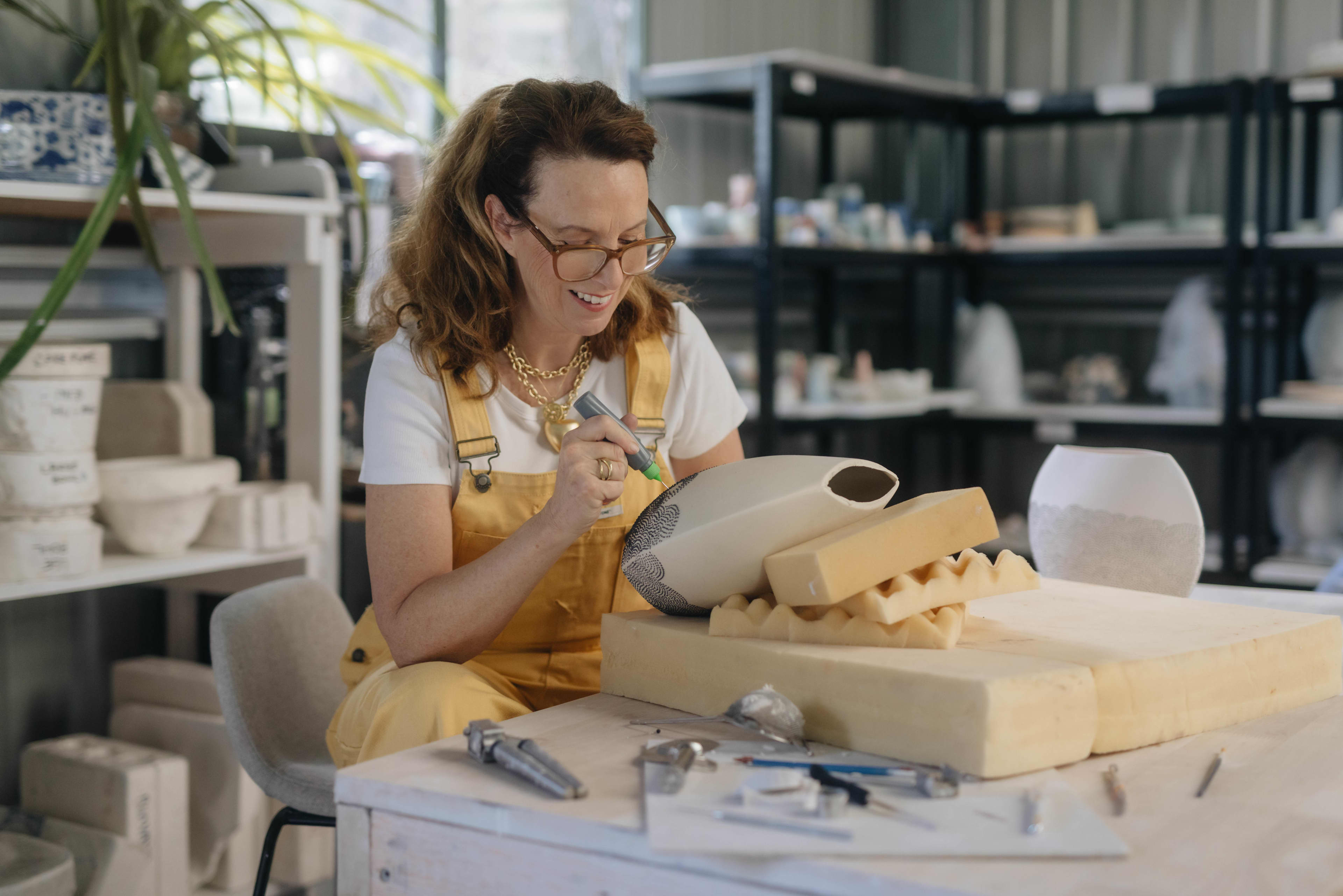 Artist Kate Lethlean working in her studio