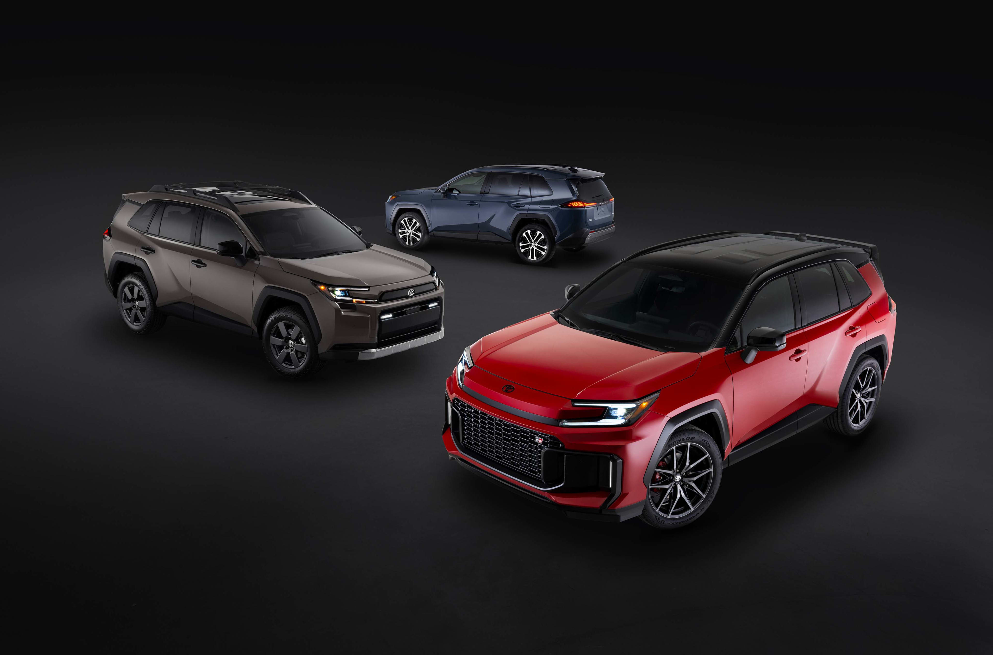 Three new Toyota RAV4s in a studio setting
