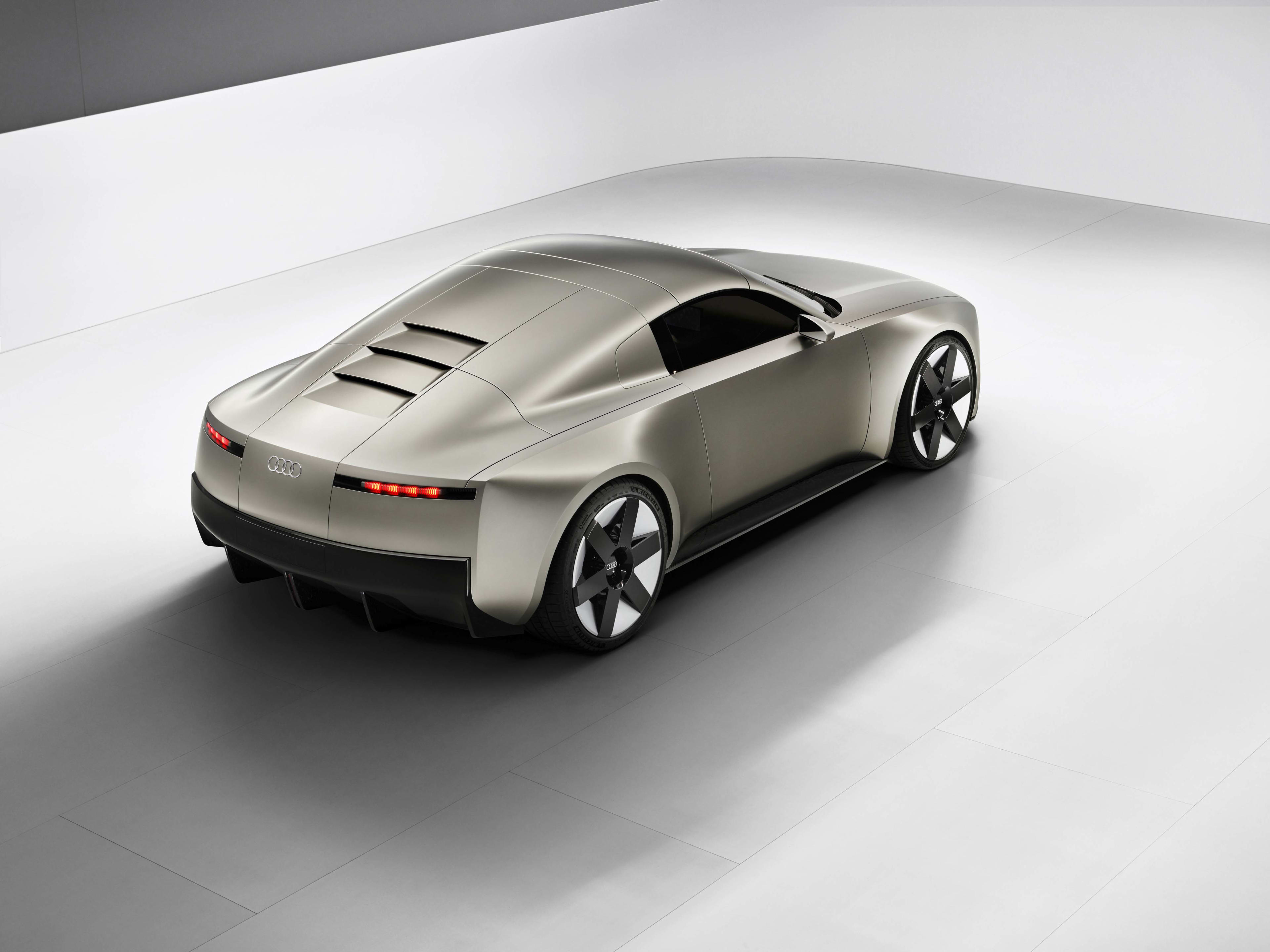 A silver Audi Concept C car in a studio setting