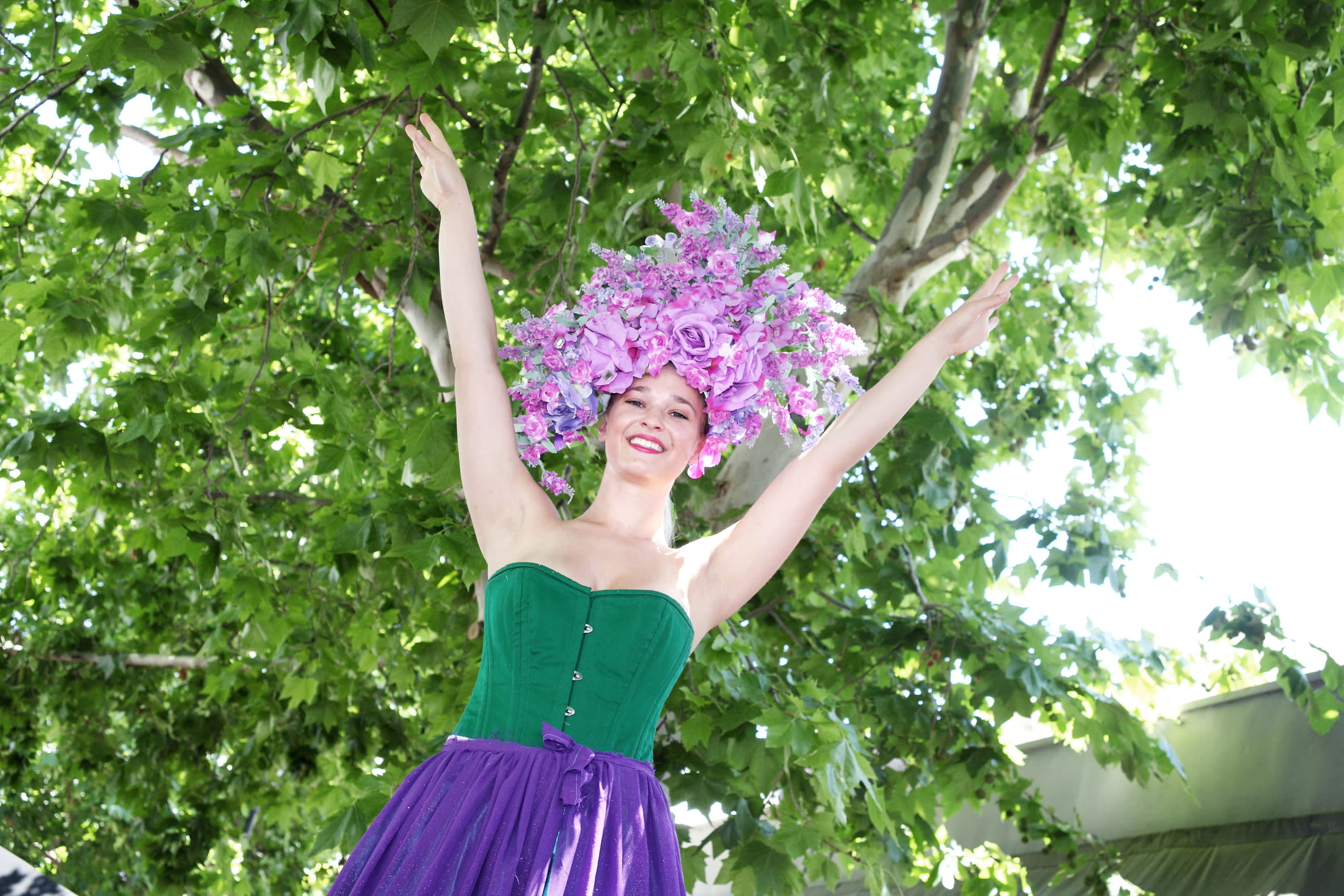 Dancer wearing purple floral headpiece