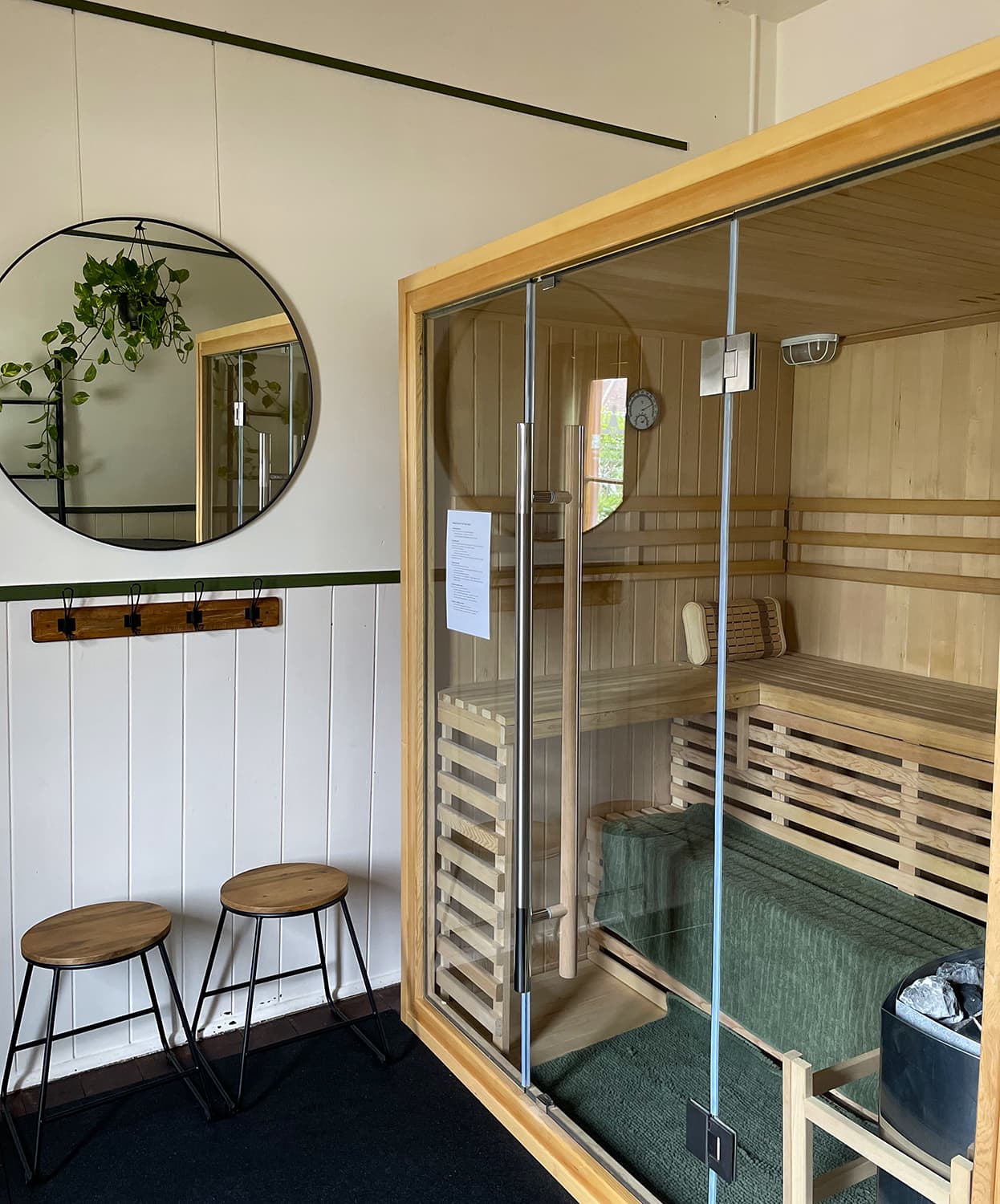 The interior of a sauna made of light coloured timber.