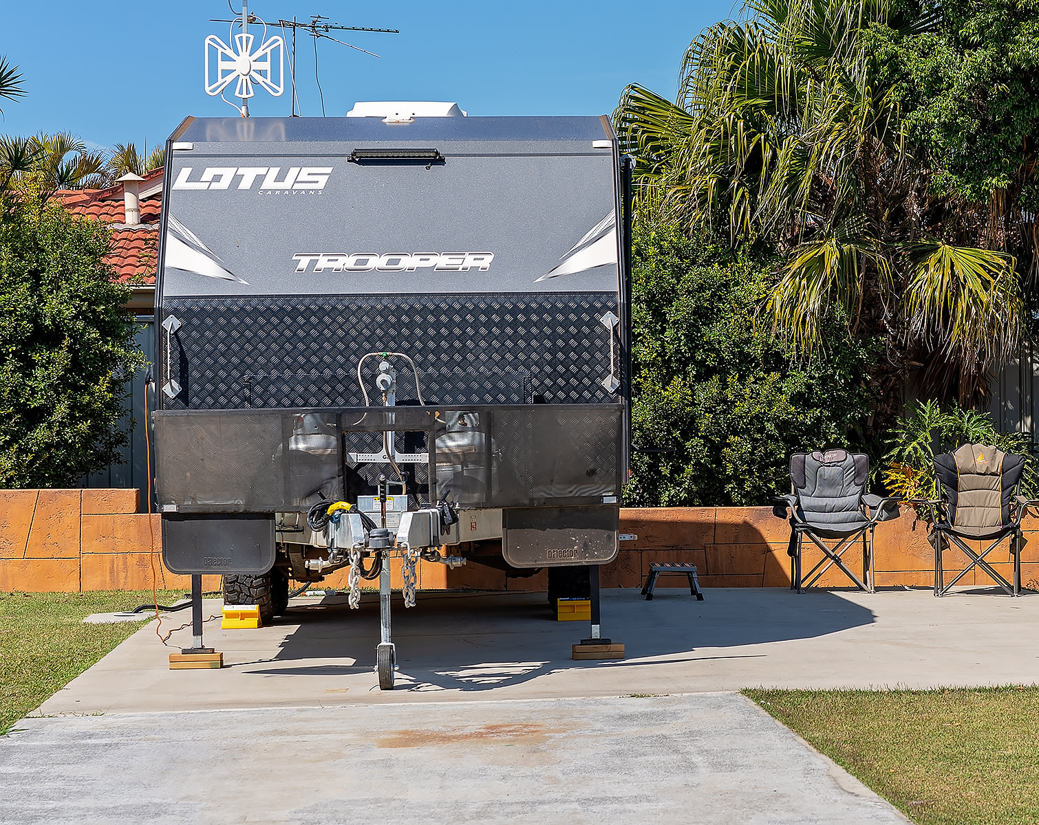 A caravan parked on a suburban driveway