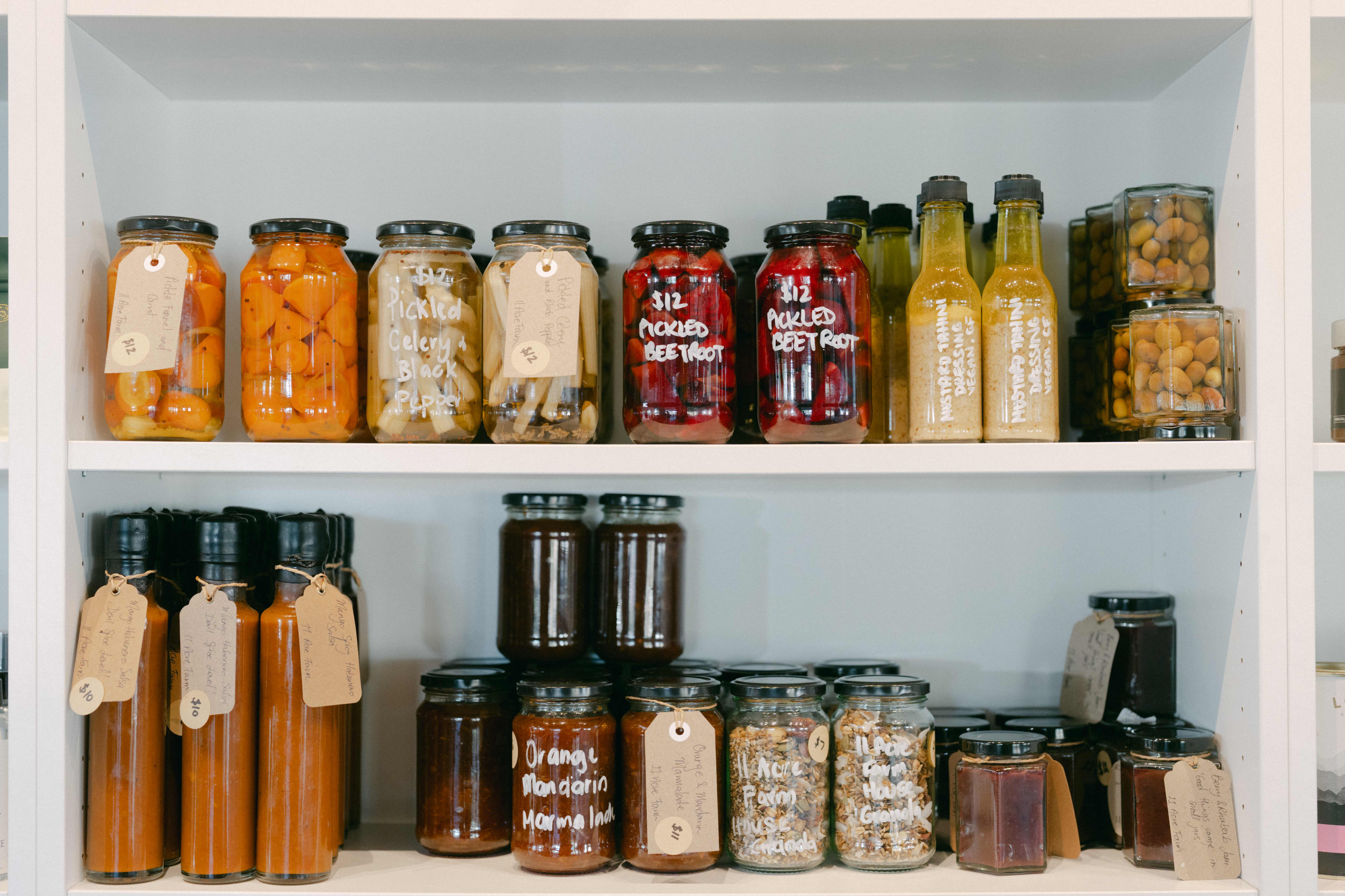 Pantry full of fermented vegetables and items on shelf