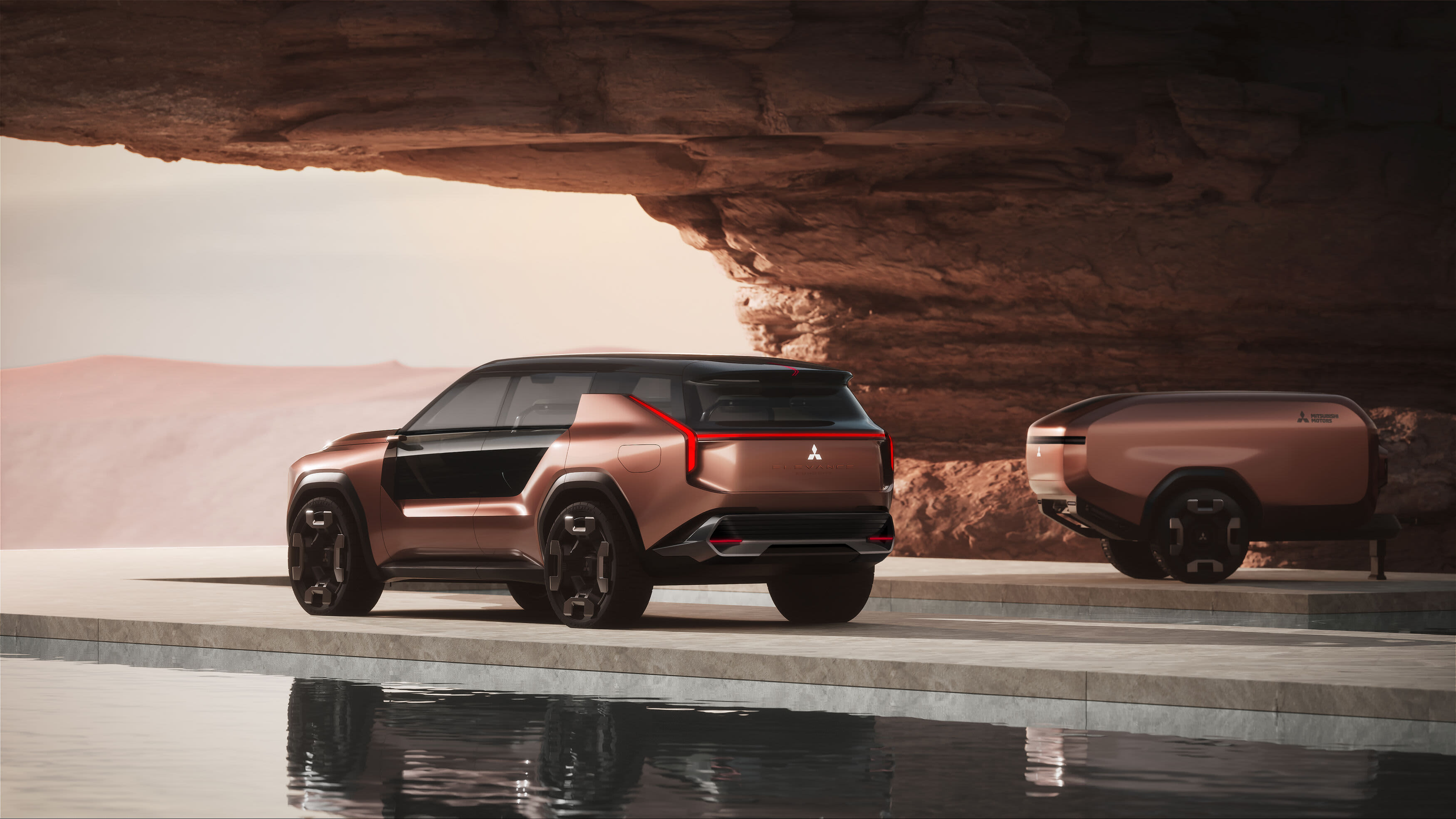 A brown Mitsubishi Elevance in a coastal setting