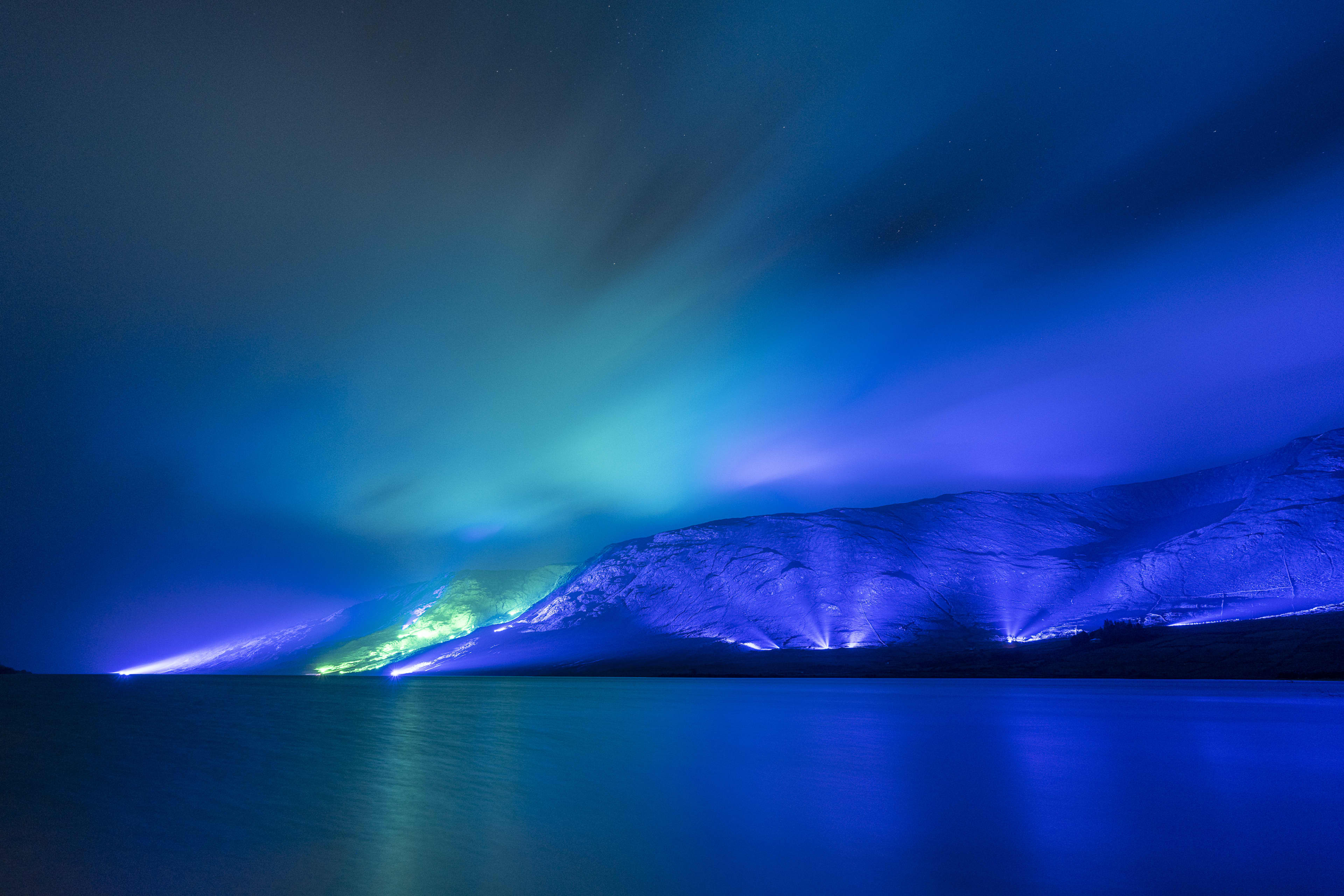 Mountains illuminated in blue at night in Ireland
