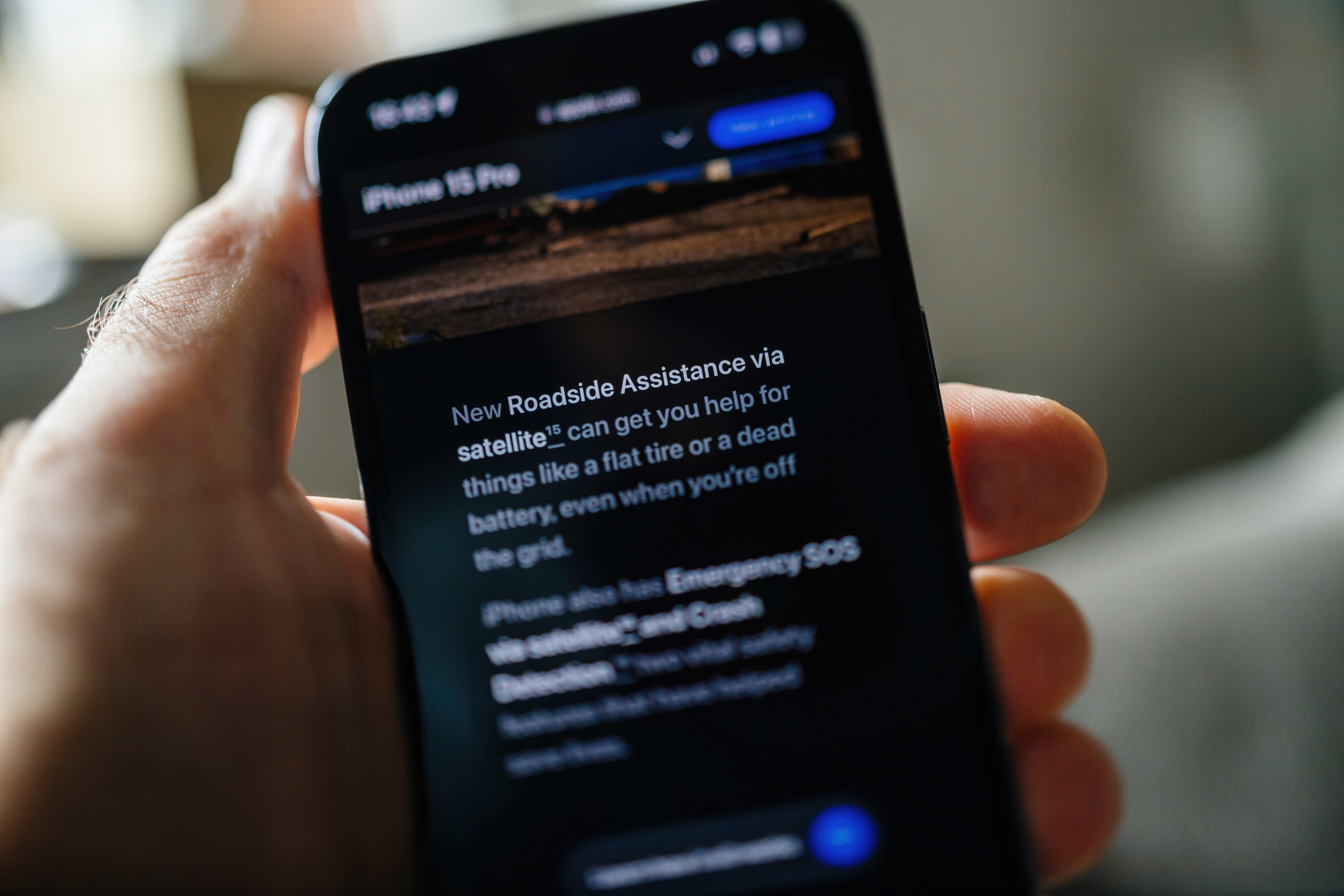 A mobile phone showing Apple's Roadside Assist feature