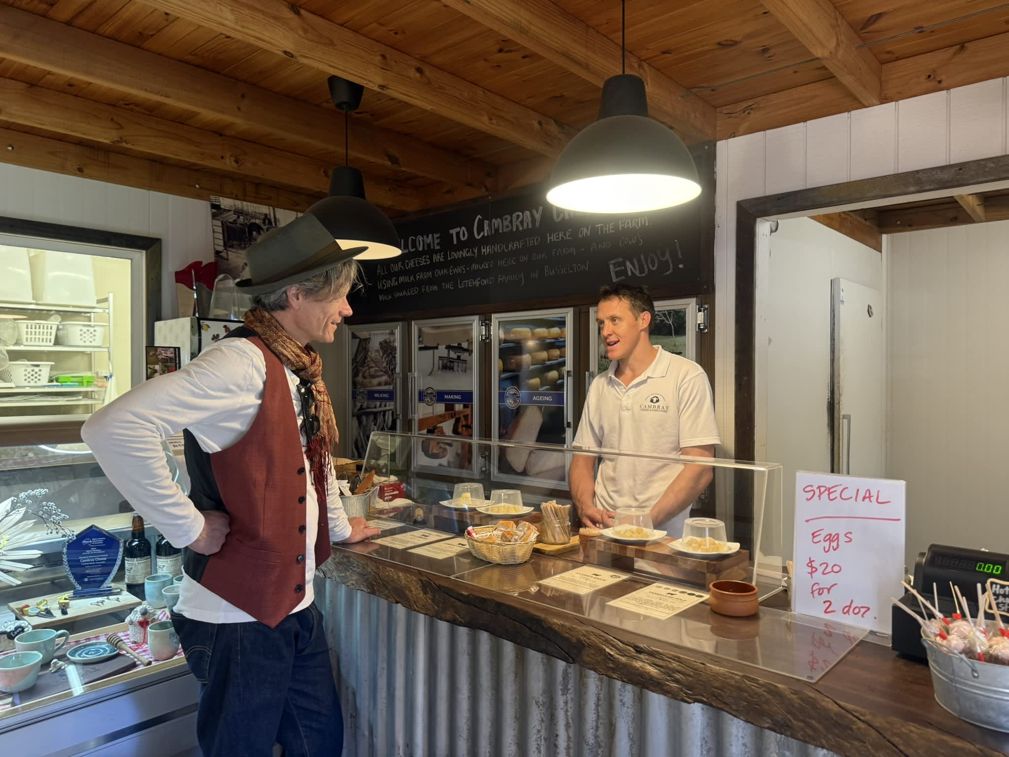 A customer at the counter at Cambray Cheese