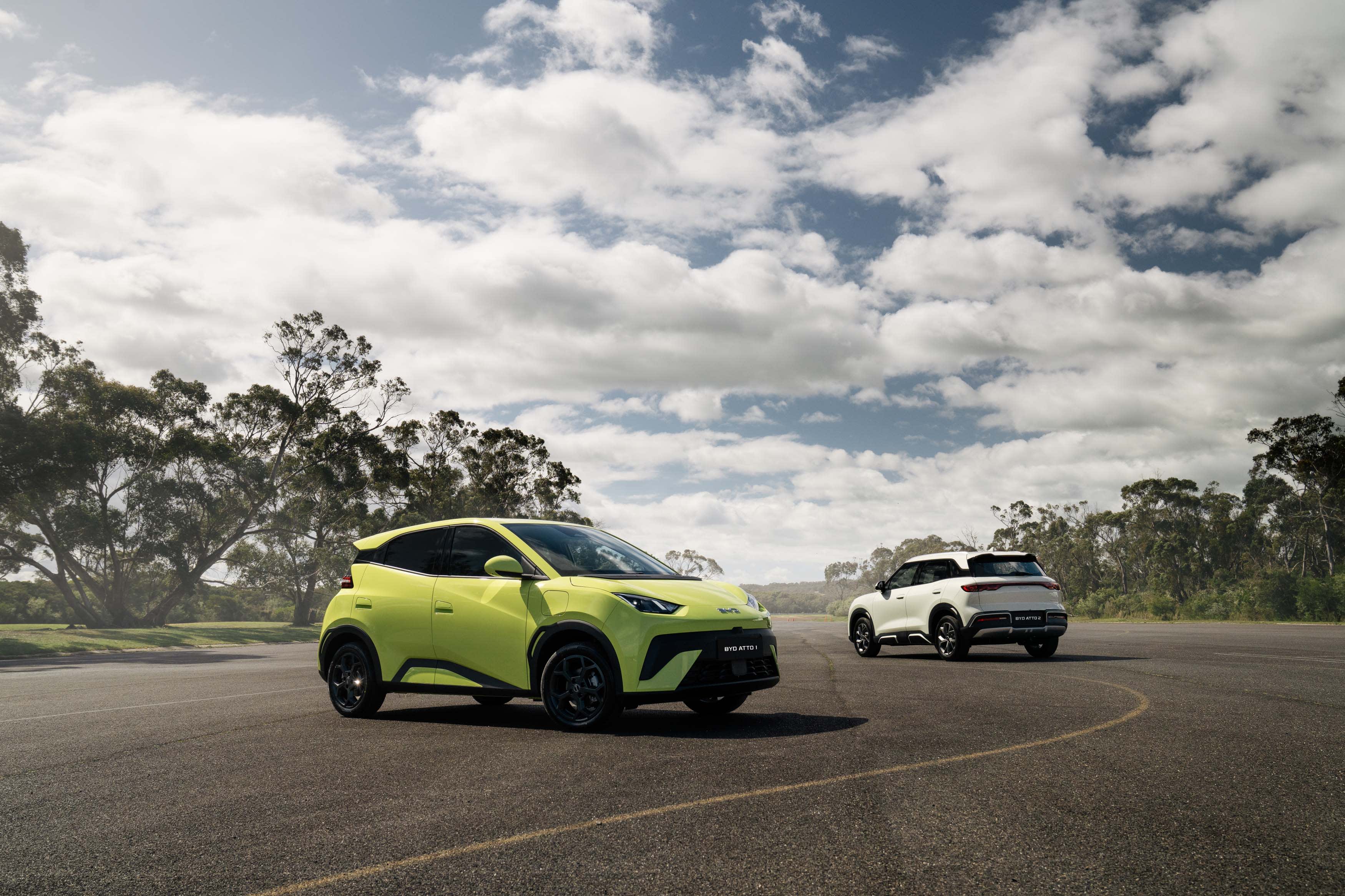 Two BYD Atto 1 EVs on a tarmac