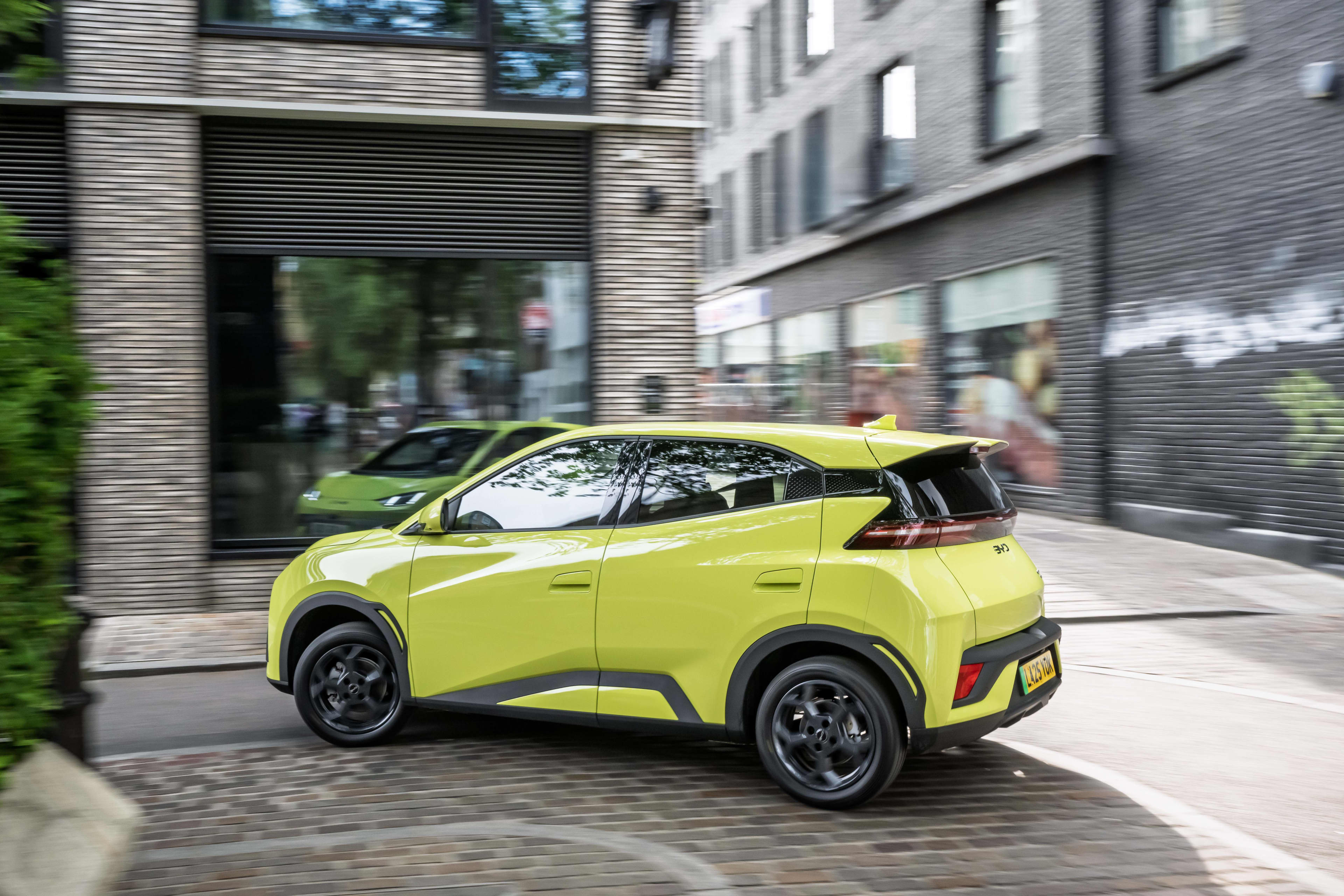 A lime green BYD Atto 1 shown from a rear view