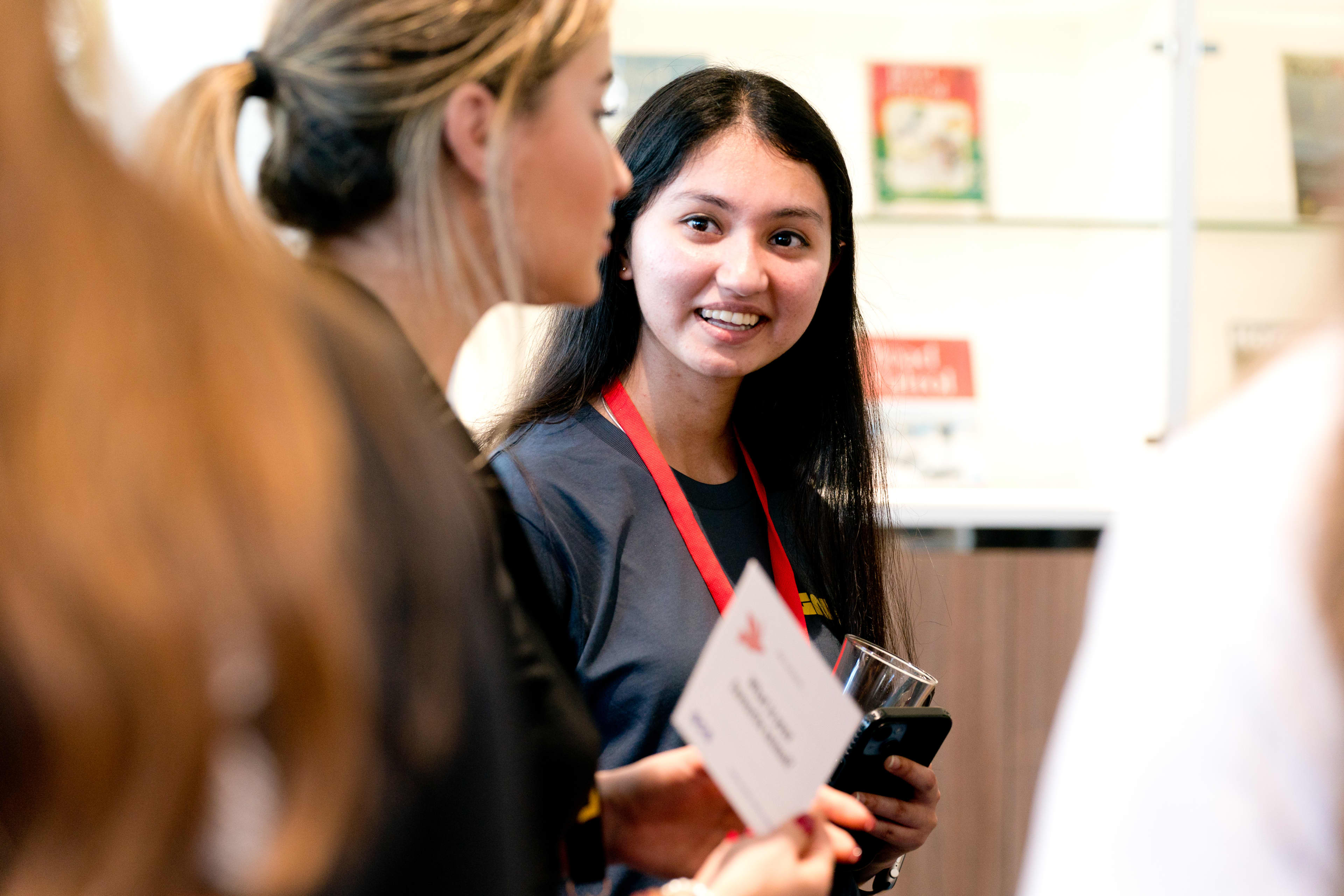 Two women in conversation at the 2023 Ignite event.