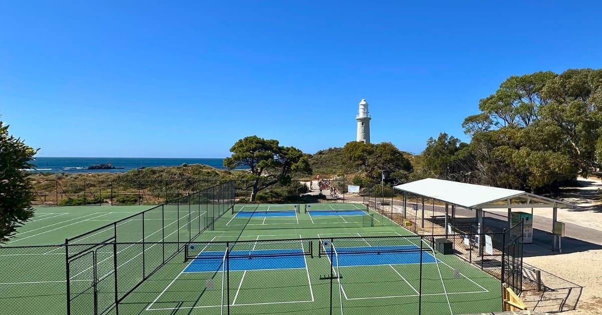 New pickleball courts on Rottnest Island with lighthouse in background and beach in distance
