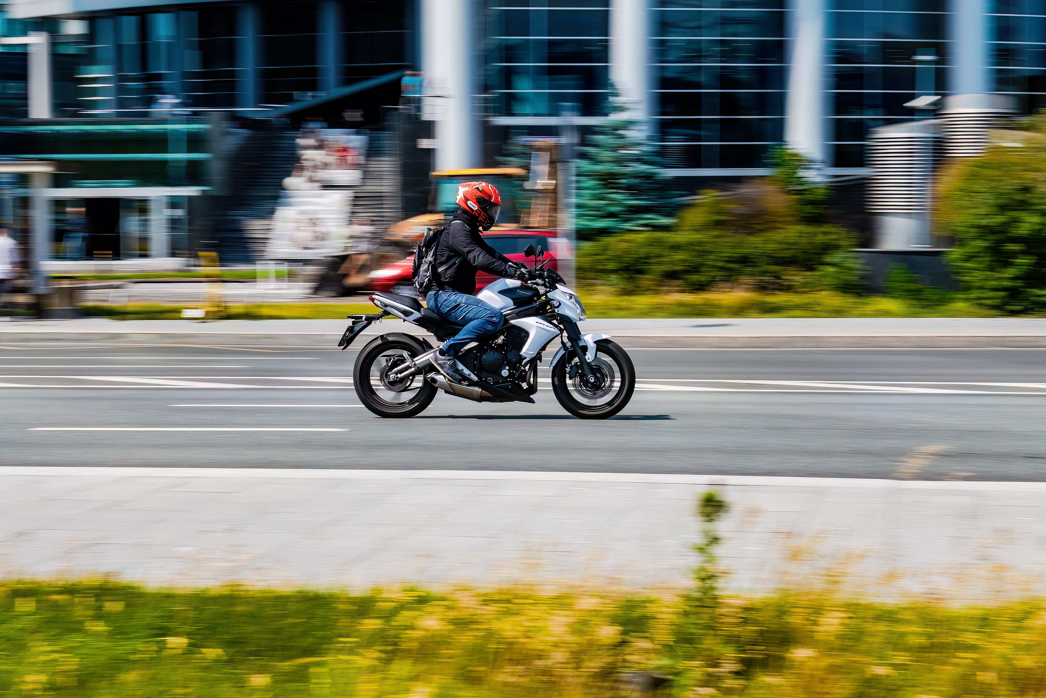 A motorcycle rider on a city street