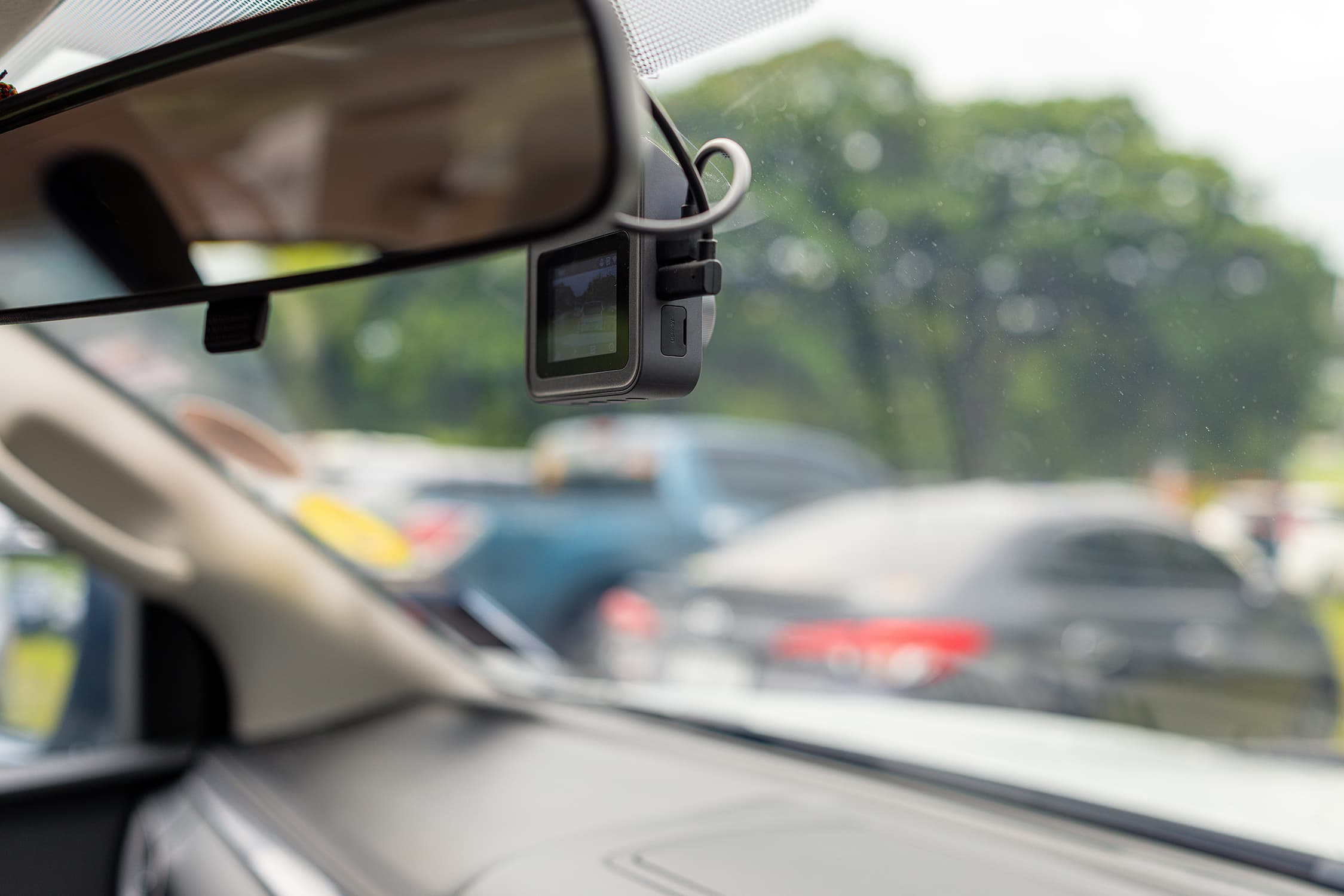 A close up of a dashcam seen from the car interior