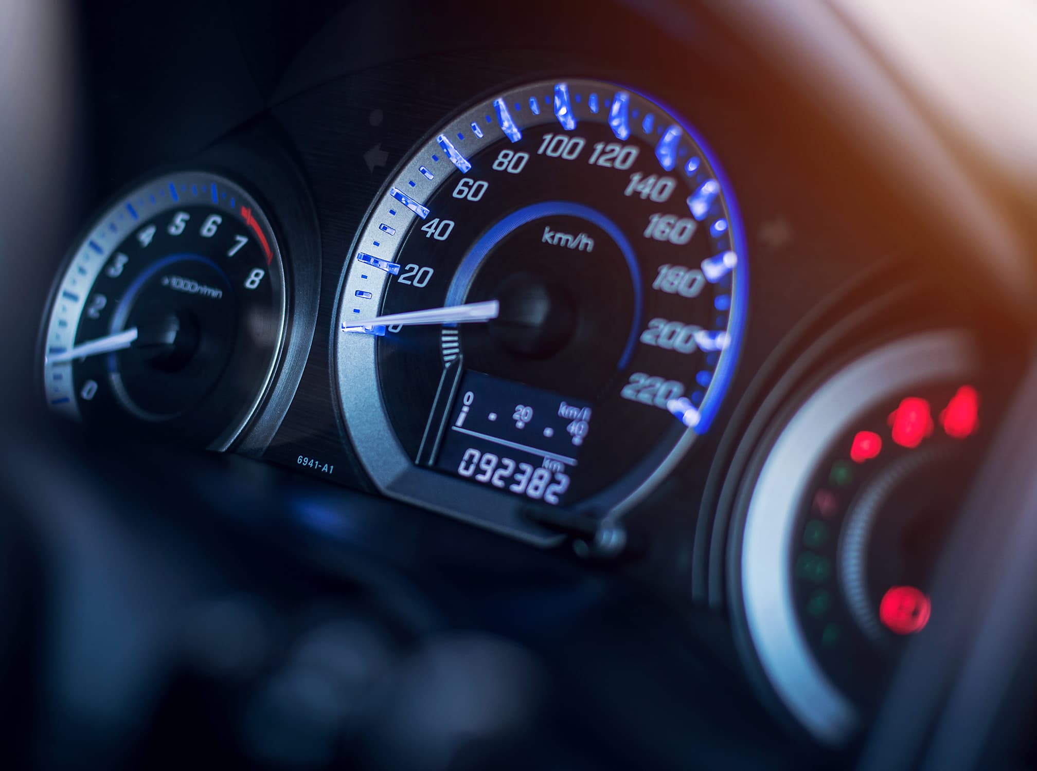 A close up of a car speedometer